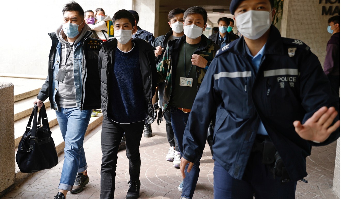 Activist Lester Shum is taken away by police on Wednesday morning. Photo: Reuters