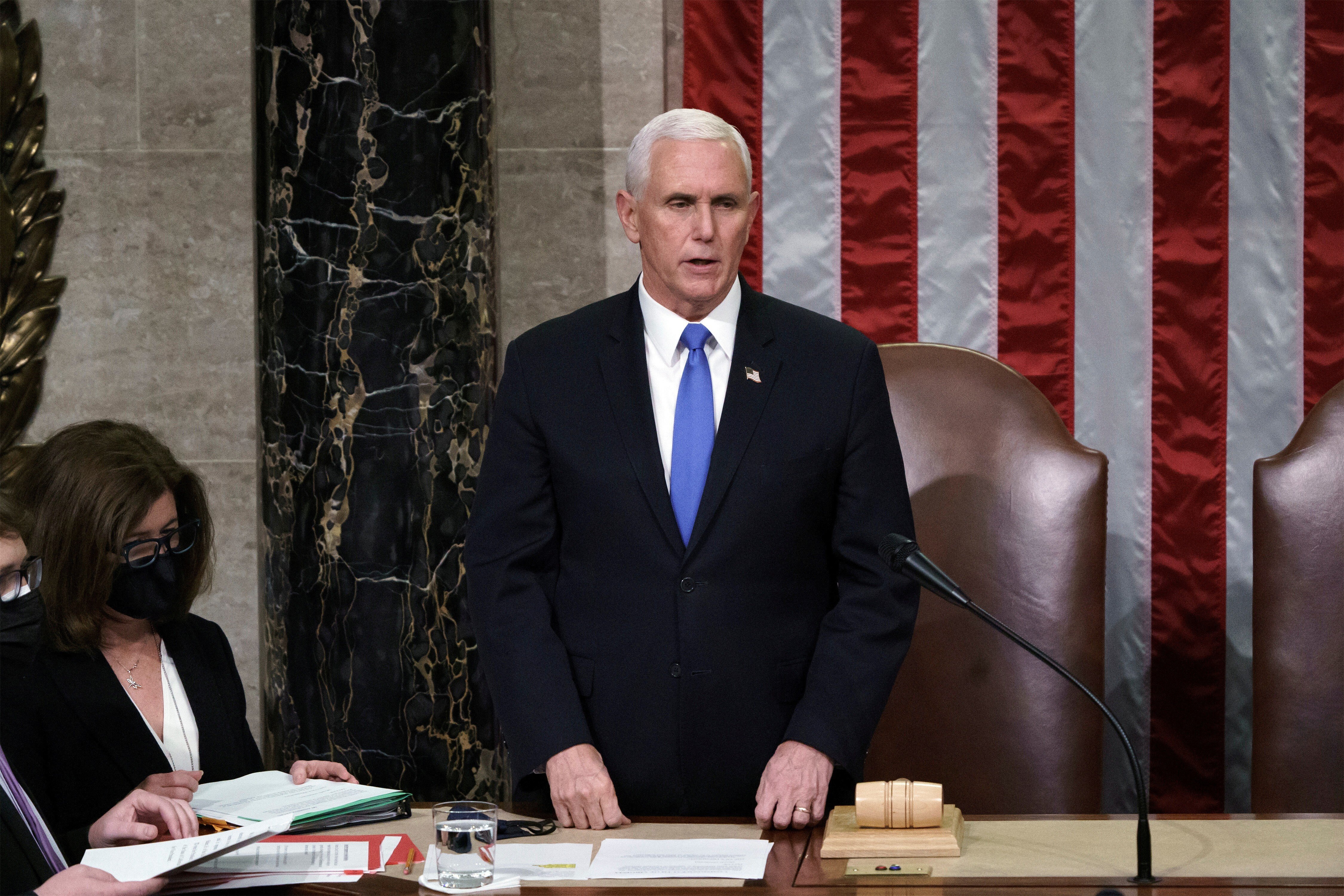 US Vice-President Mike Pence reads the final certification of Electoral College votes at the Capitol on Wednesday. Photo: Reuters