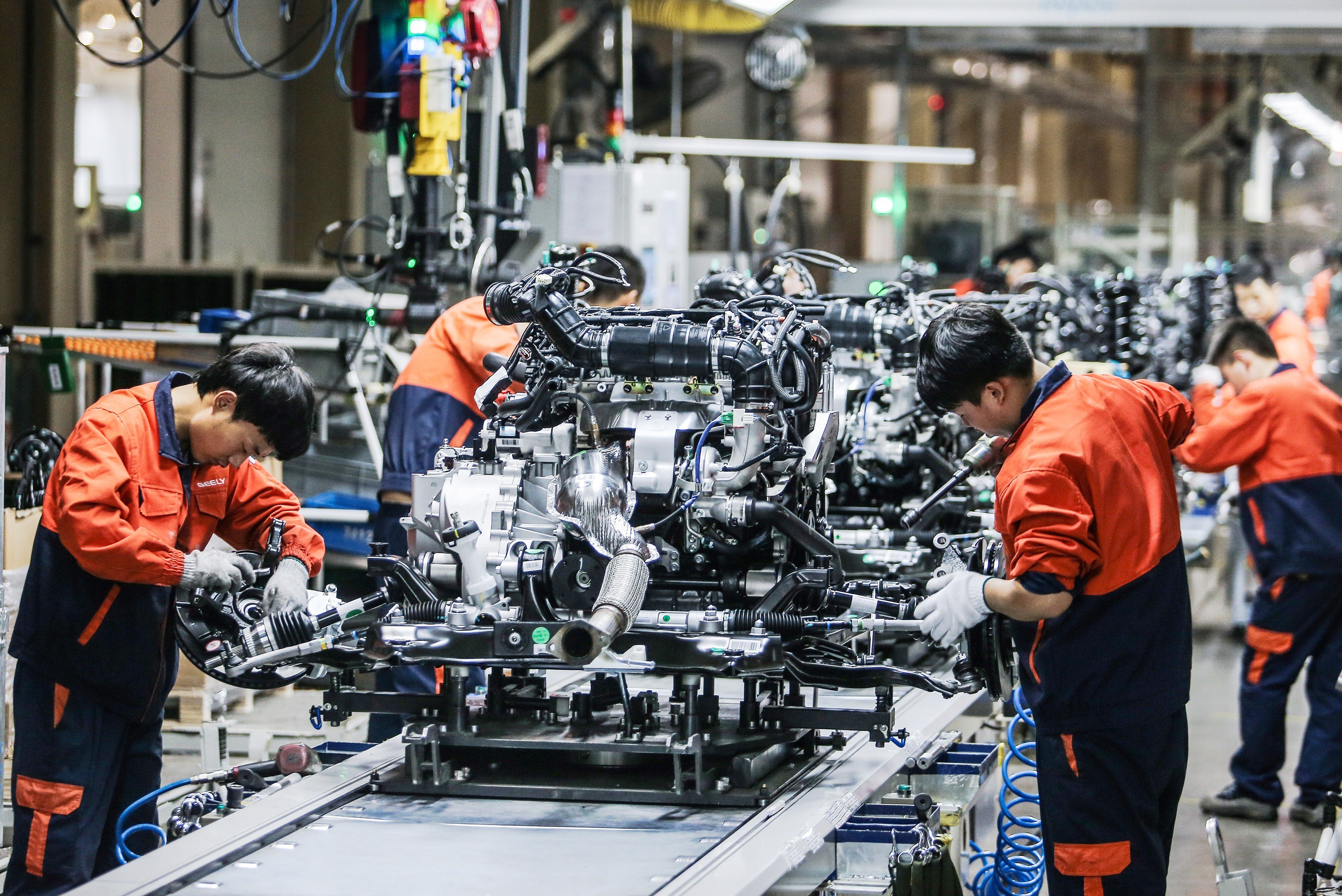 Staff work on an engine production line of Geely Automobile in Baoji, northwest China's Shaanxi Province. Photo: Xinhua