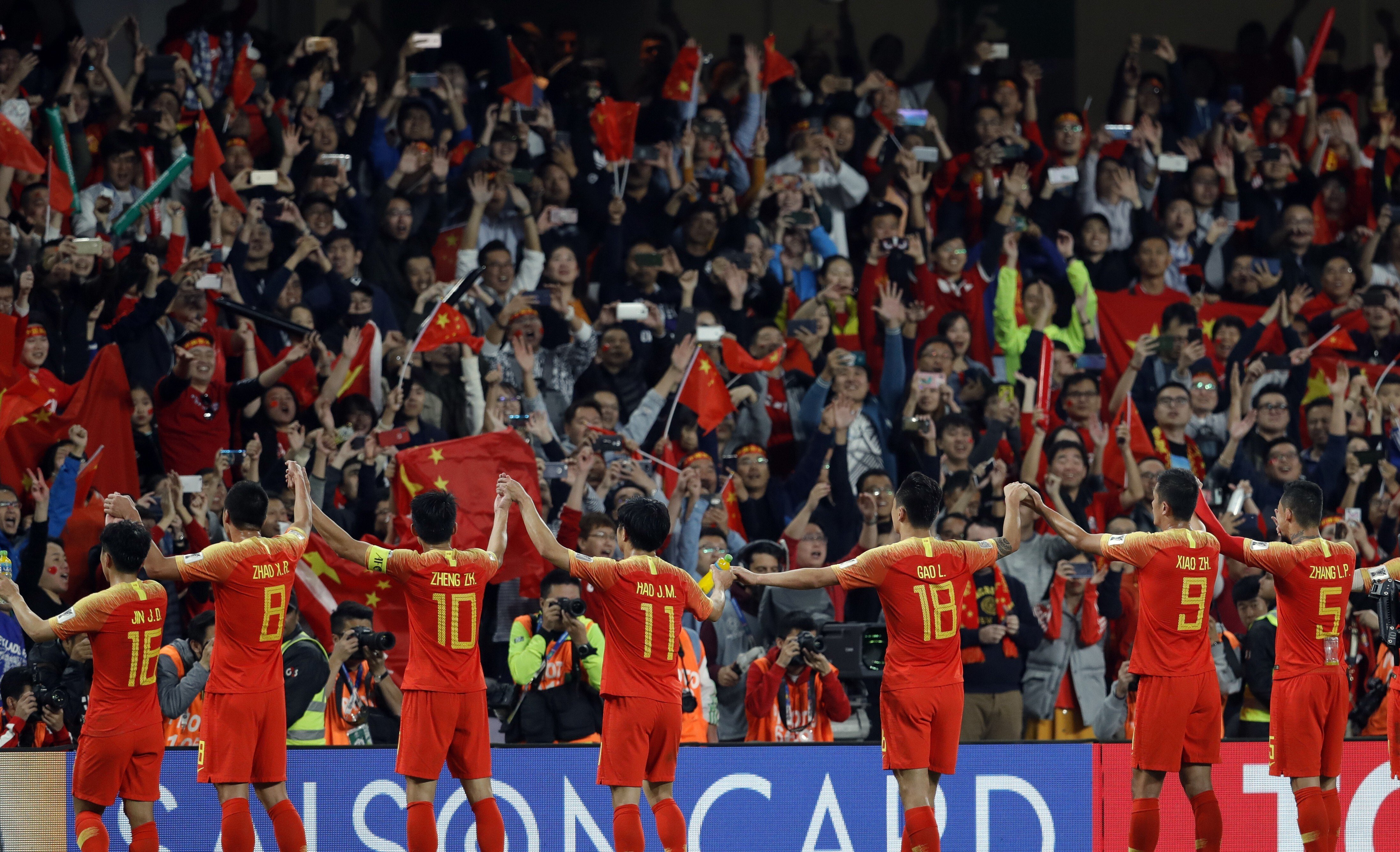 Chinese players greet supporters at the end of the AFC Asian Cup 2019 round of 16 win over Thailand. Photo: AP