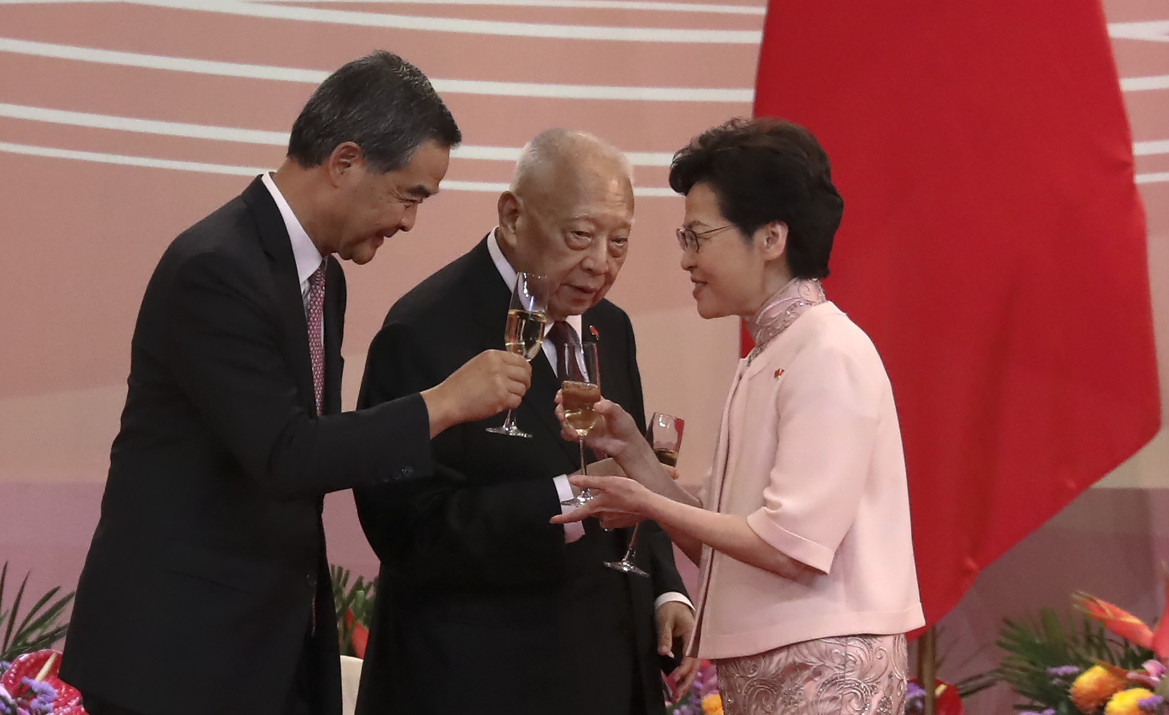 Chief Executive Carrie Lam (right) clinks her glass with former chief executives Leung Chun-ying (left) and Tung Chee-hwa at the reception for the 23rd anniversary of the establishment of the Hong Kong Special Administrative Region, at the Convention and Exhibition Centre in Wan Chai on July 1, 2020. Photo: K.Y. Cheng