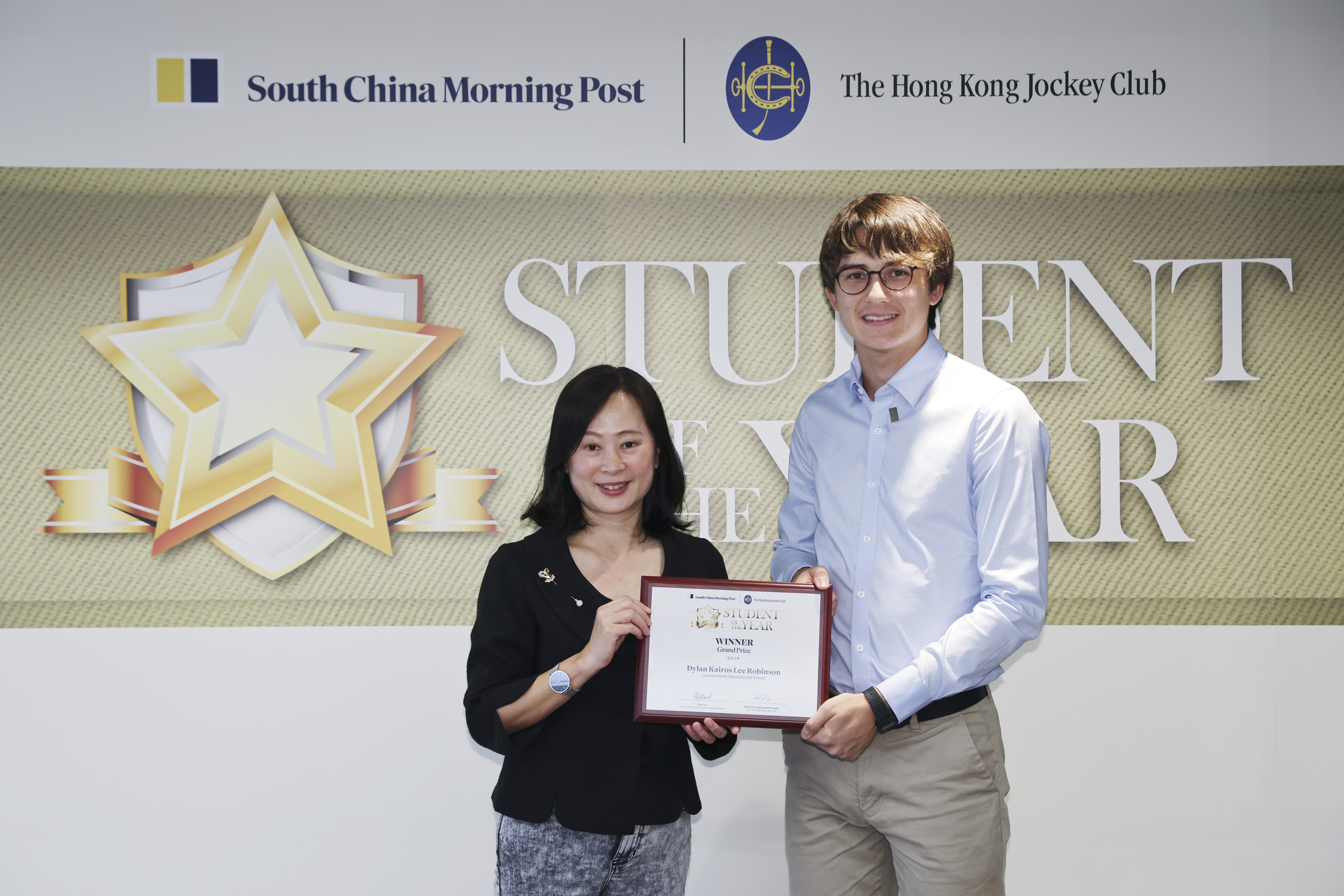 Tammy Tam, the Post’s editor-in-chief (left) and Student of Year Awards Grand Prize winner Dylan Robinson. Photo: Nora Tam