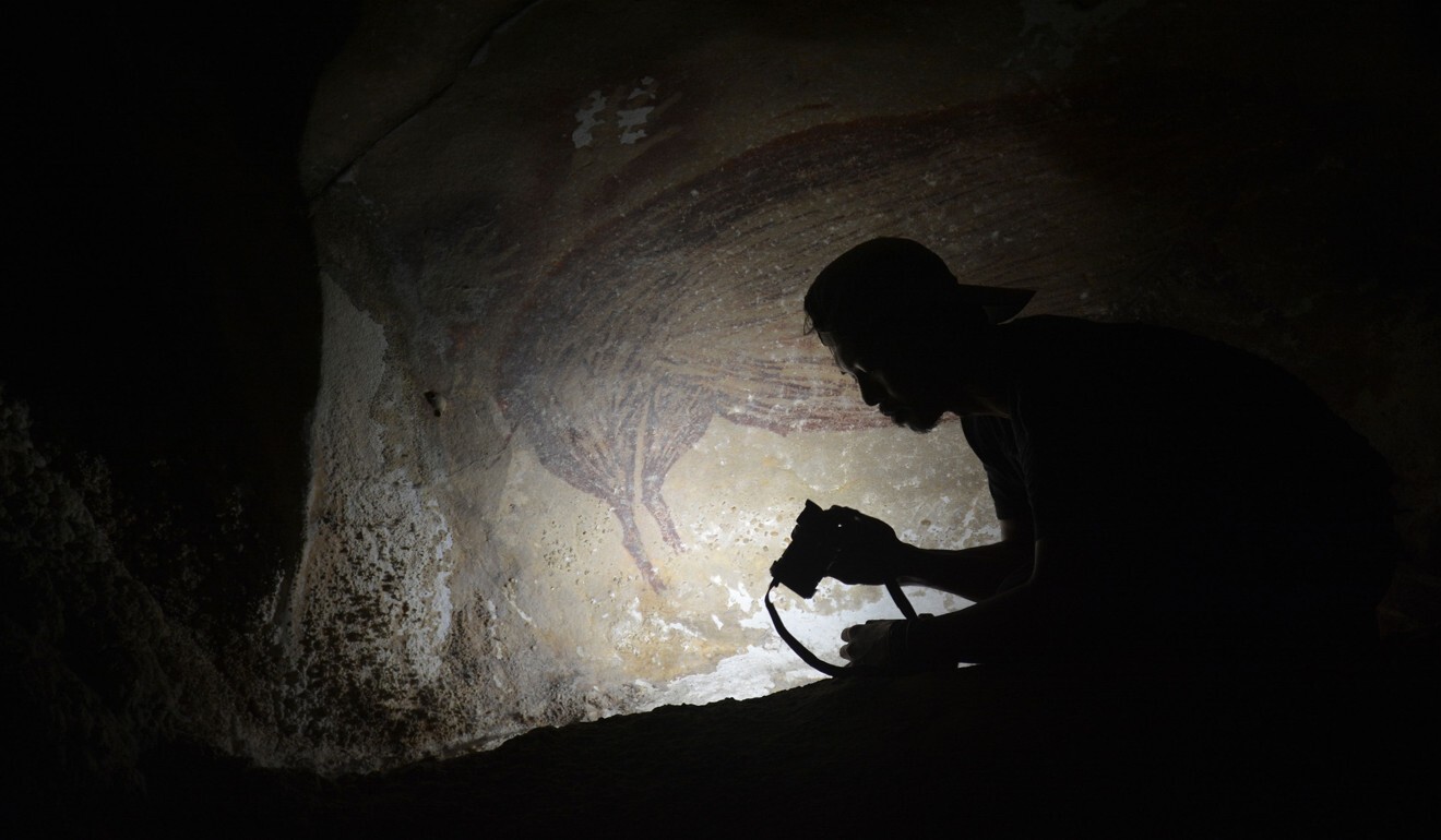 The painting was found on the island of Sulawesi in 2017 by doctoral student Basran Burhan. Photo: Griffith University / AFP