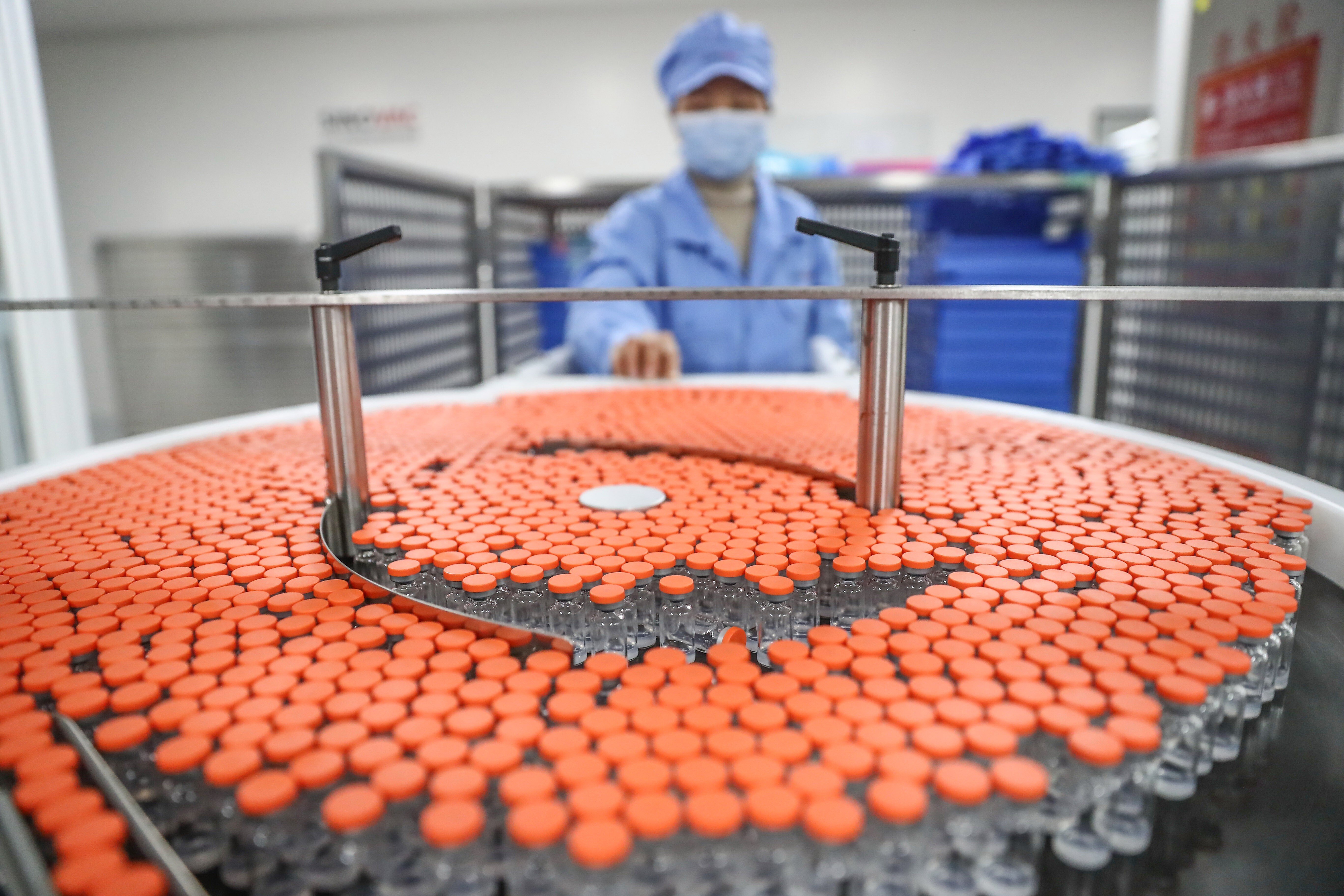 An employee of Sinovac Research and Development at work on January 6 in the company’s Covid-19 vaccine packaging plant in Beijing. Photo: Xinhua