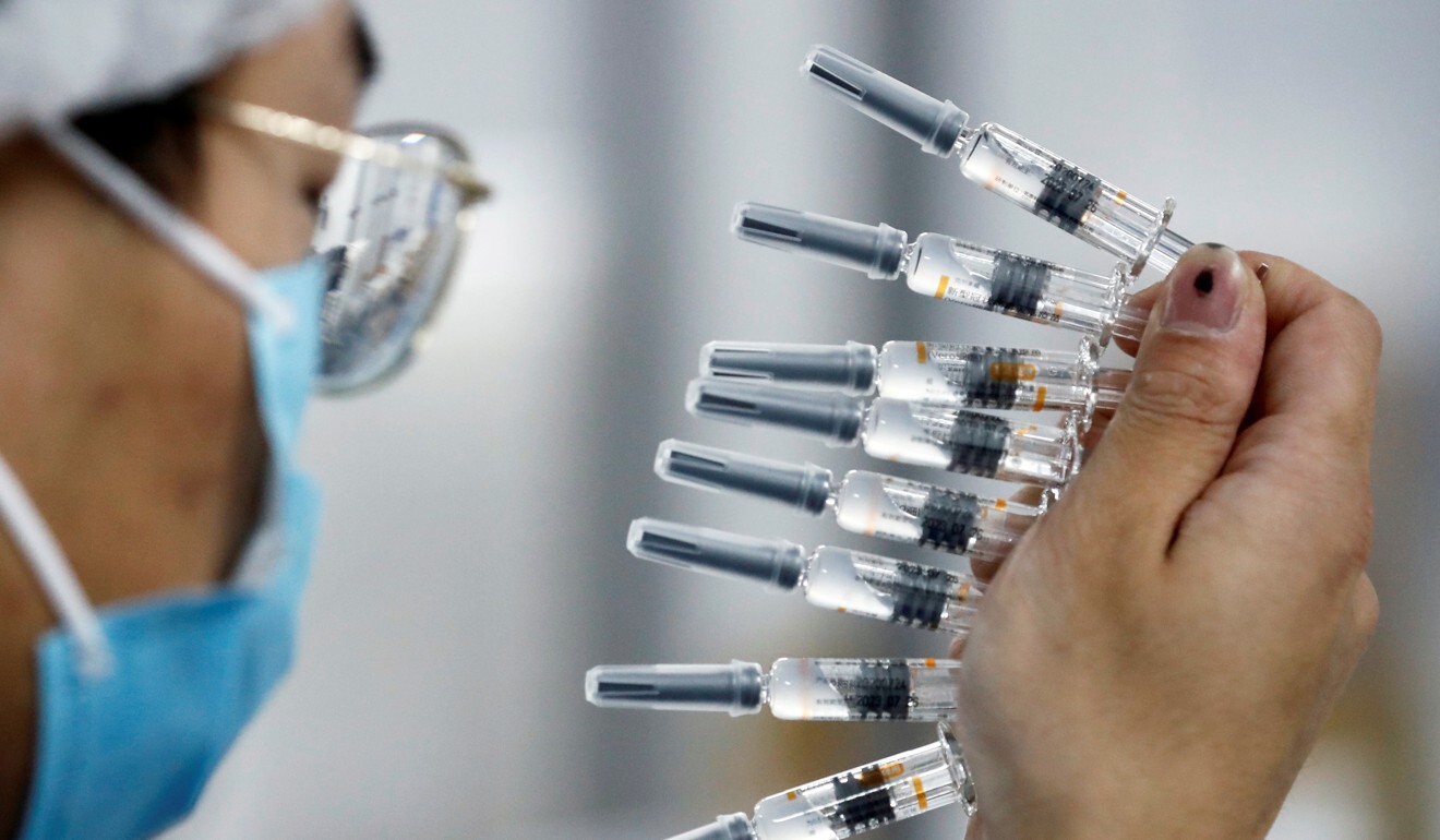 A worker performs a quality check in the packaging facility of Chinese vaccine maker Sinovac Biotech. Photo: Reuters
