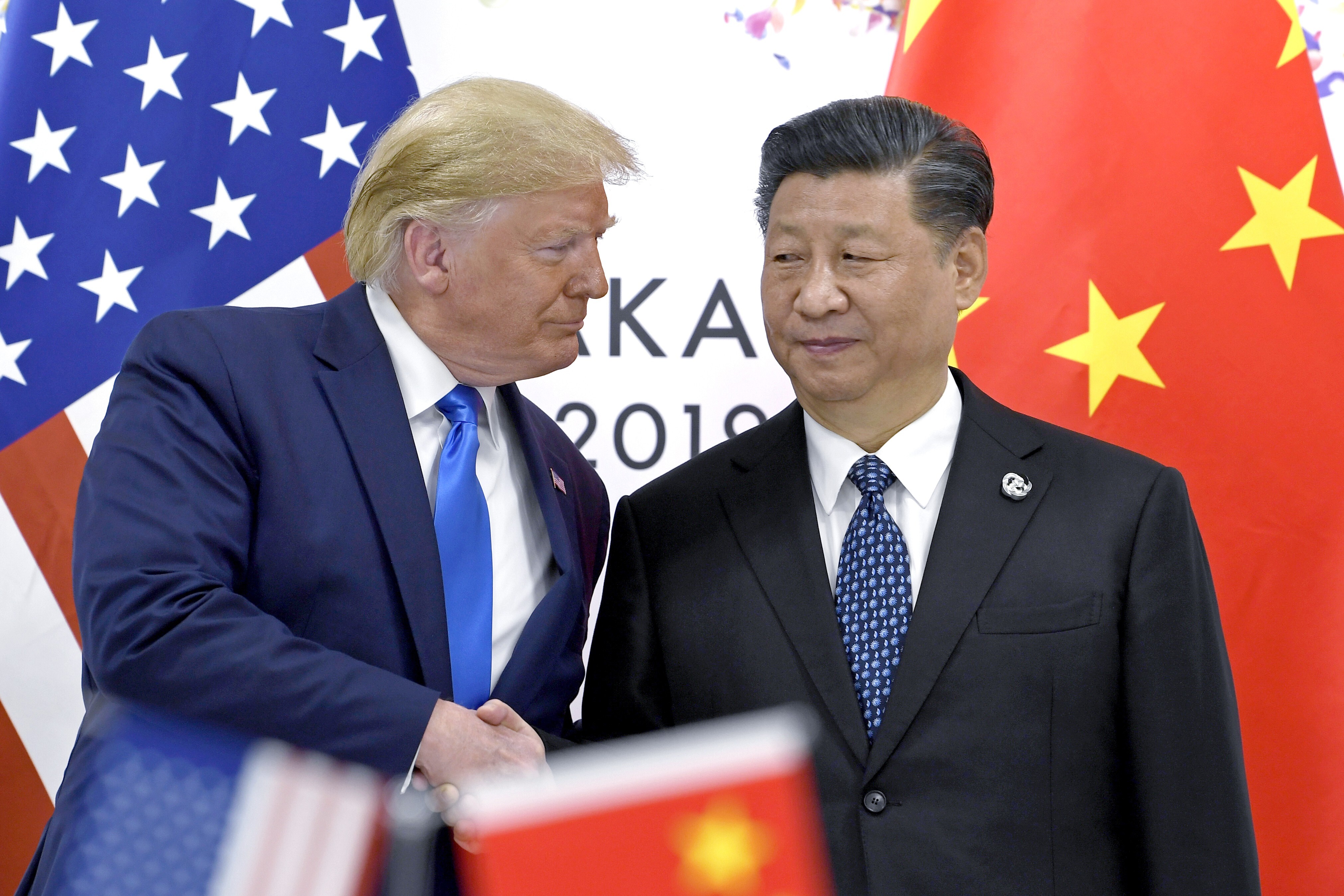 US President Donald Trump shakes hands with President Xi Jinping during a meeting on the sidelines of the Group of 20 summit in Osaka, Japan, on June 29, 2019. The phase one trade deal Trump secured after years of confrontational, tariff-focused dealings with China has yet to live up to its promises. Photo: AP