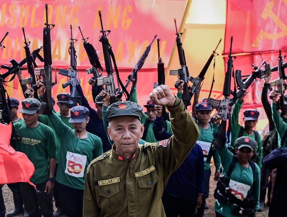 Members of the New People's Army during their 50th founding anniversary celebration in the Sierra Madre mountains in March 2019. The communist insurgency has long been a thorn in the side of President Rodrigo Duterte. Photo: EPA-EFE