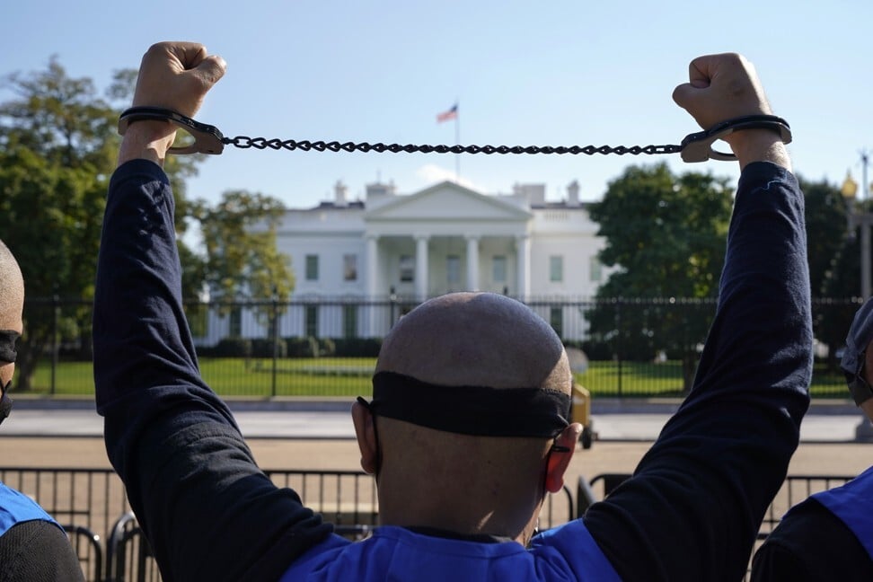 A member of the Uygur American Association rallies in front of the White House after marching from Capitol Hill in Washington on October 1 in support of the Uygur Forced Labour Prevention Act. Photo: AP