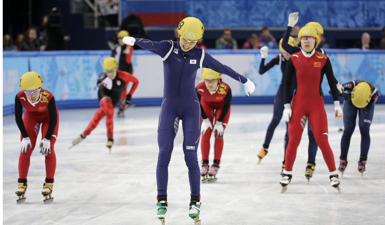 Shim Suk-Hee, centre, celebrates as she crosses the finish line to win in the women's 3,000m relay final during the 2014 Winter Olympics. Photo: AP
