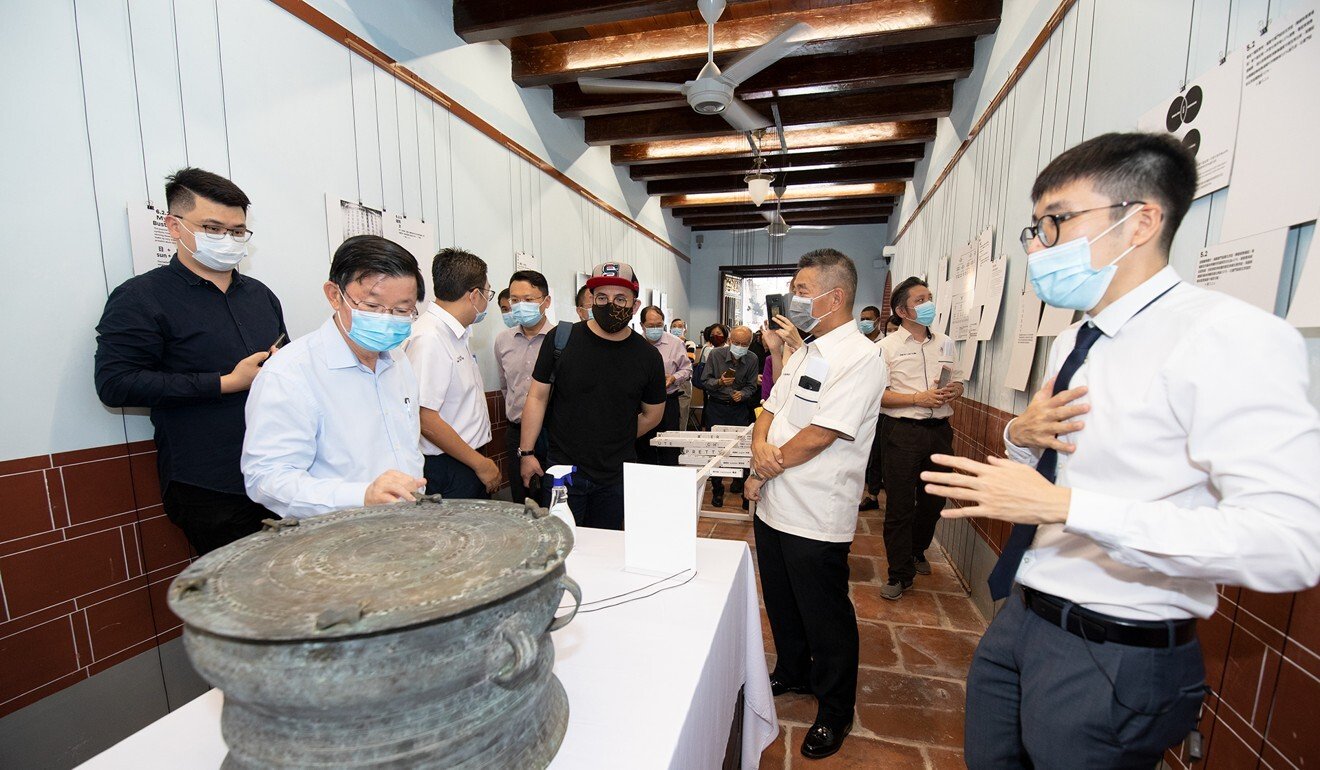 Sim Tze Wei (right) at an exhibition in Penang called “The Death and Life of Hokkien: How an ideology wiped out your language”. Photo: Handout