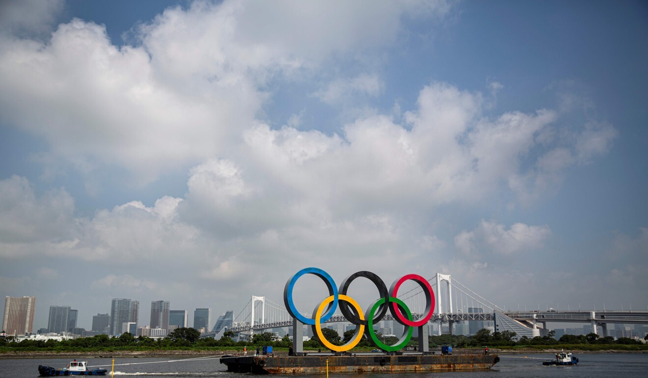 Giant Olympic rings are being transferred back to the factory where it was made for safe keeping. Photo: AFP