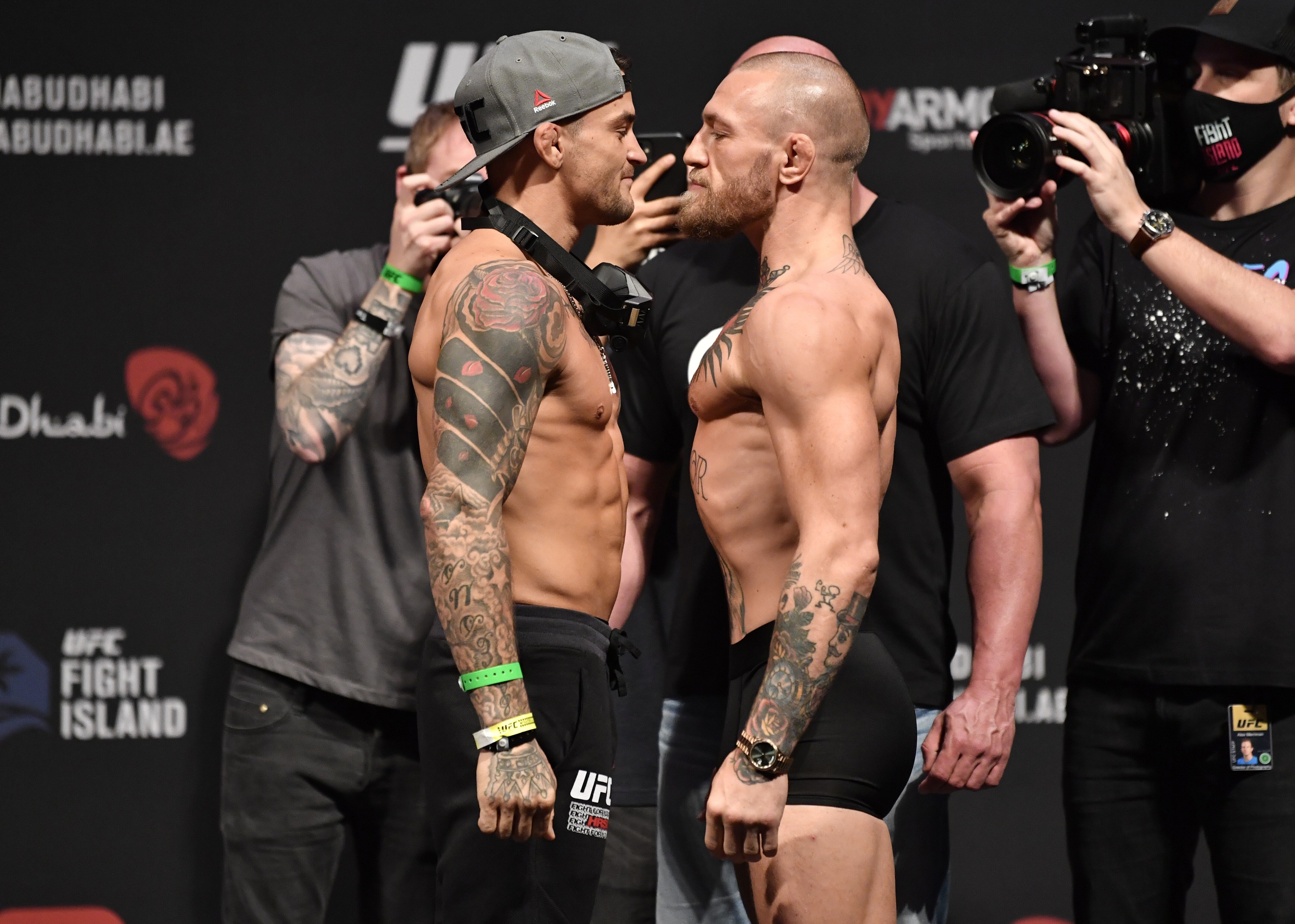 Dustin Poirier (left) and Conor McGregor face off during the UFC 257 weigh-in at Etihad Arena. Photos: Jeff Bottari/Zuffa LLC