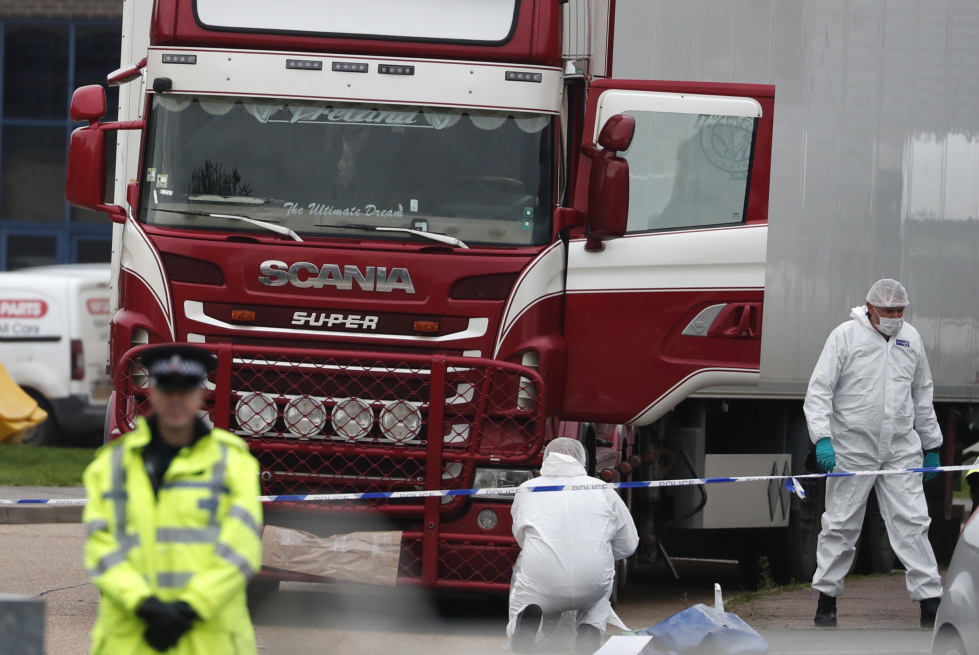 British forensics officers work on the truck, which was found to contain the bodies of 39 people, at an industrial estate east of London in 2019. File photo: AP