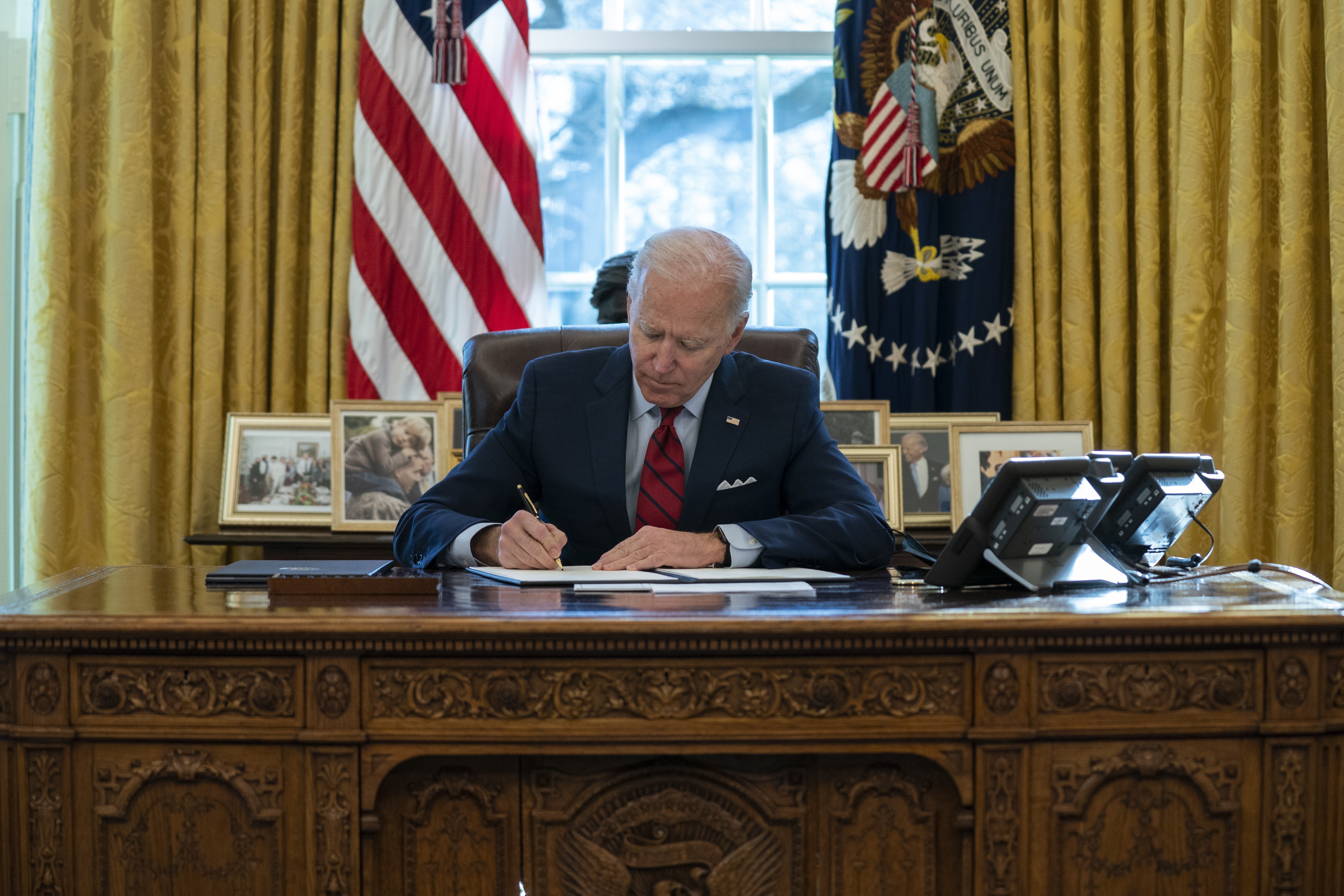President Joe Biden's Covid-19 relief plan involves sending stimulus money to many people in the US. Photo: AP
