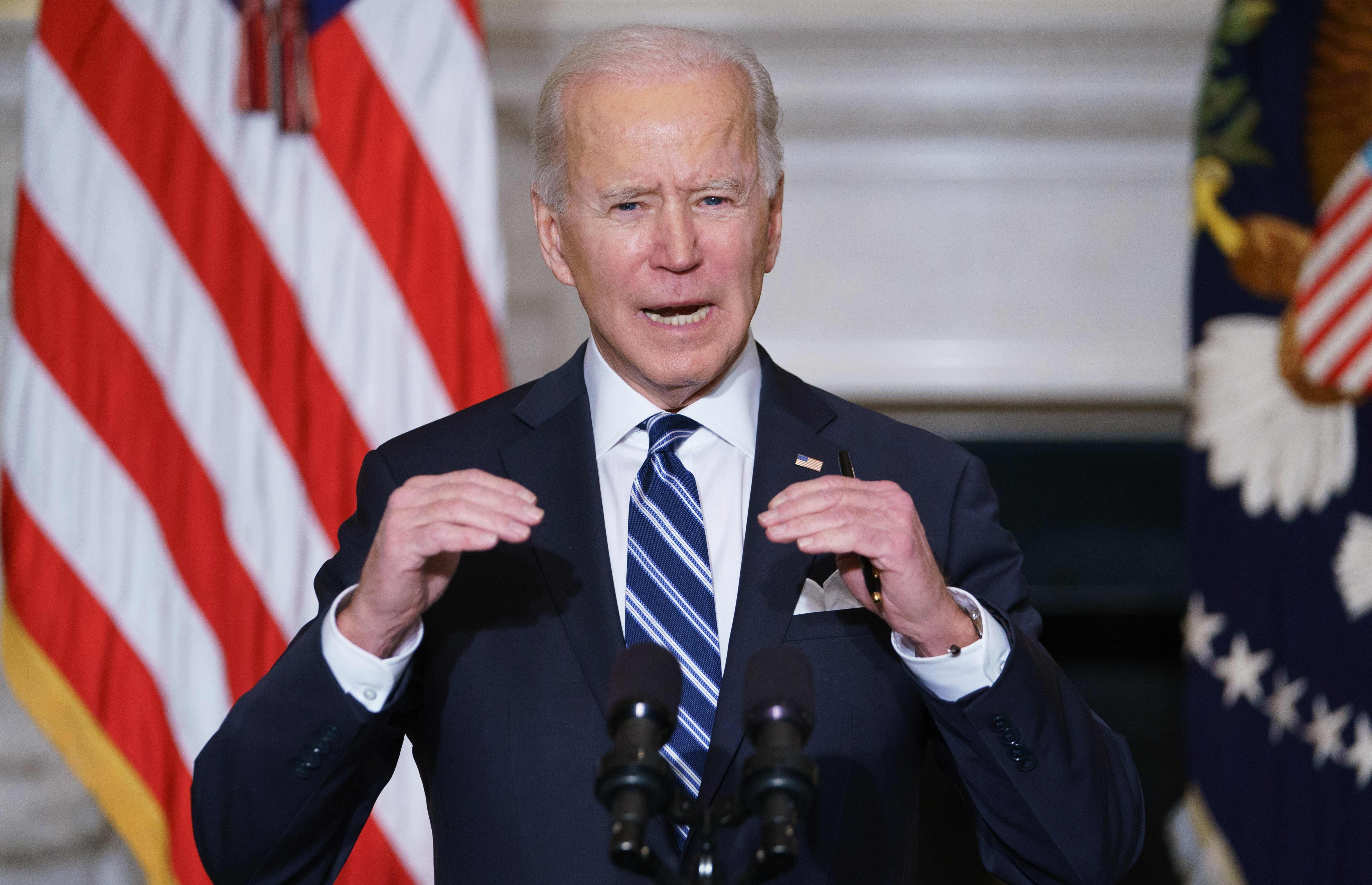 US President Joe Biden speaks on climate change and job creation before signing executive orders in the State Dining Room of the White House on January 27. Photo: AFP