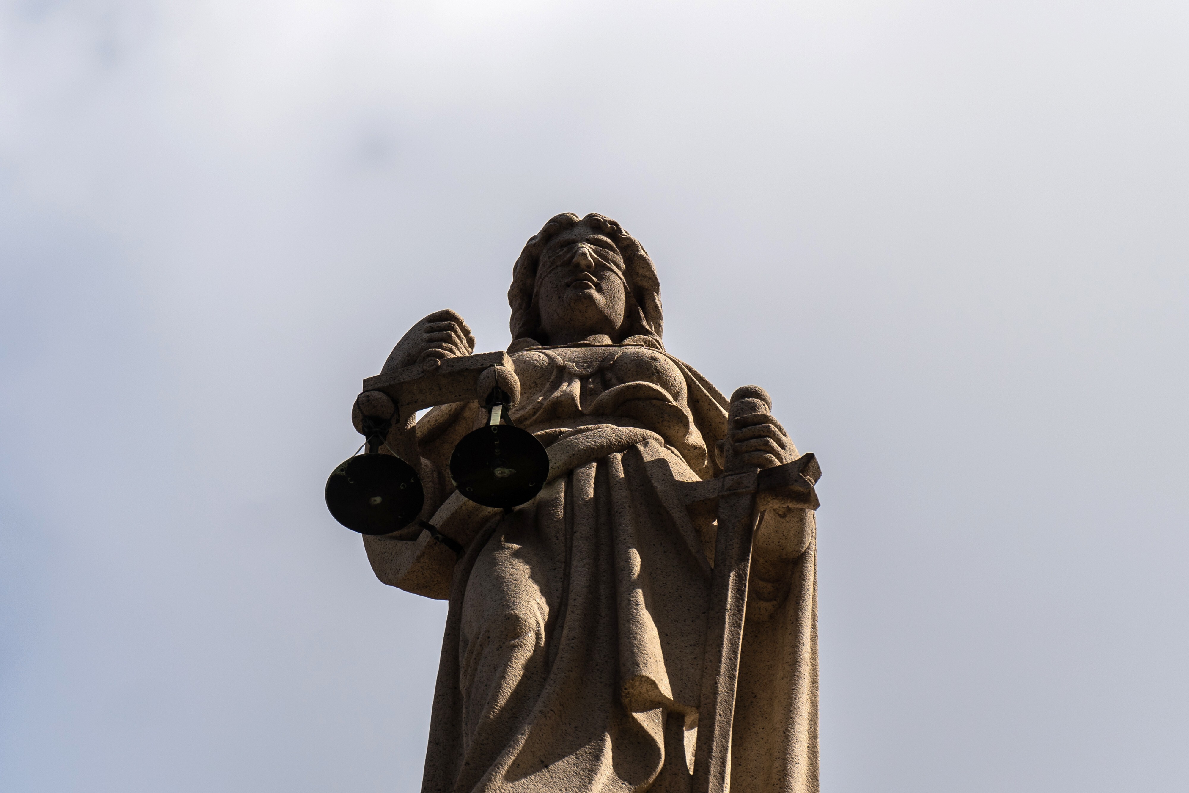 A statue of Lady Justice stands atop the Court of Final Appeal in Hong Kong on February 1. Photo: Bloomberg