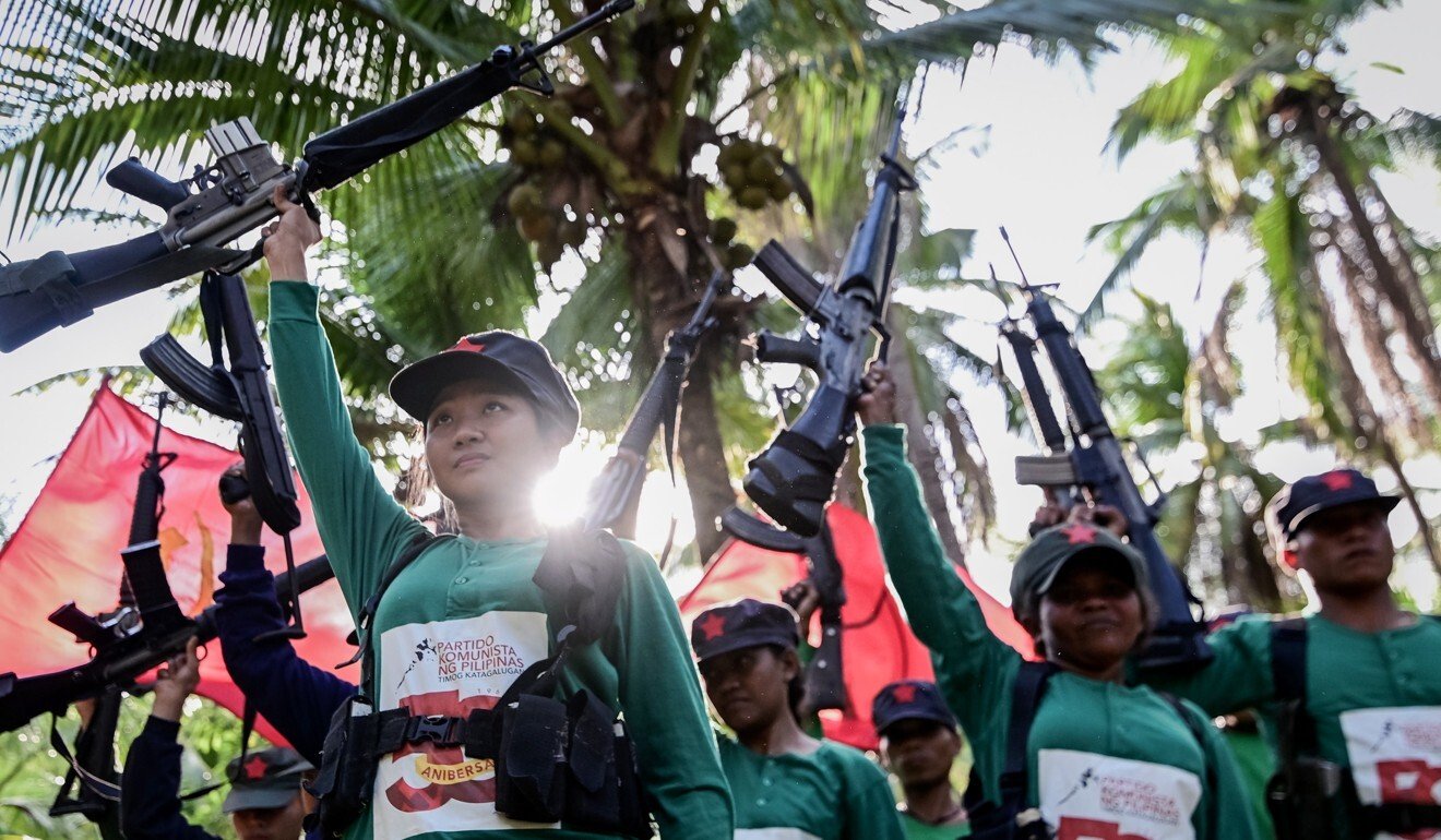Fighters of the New People's Army pictured in 2019 at a celebration marking 50 years since its foundation. Officials say going after ‘red-tagged’ groups cuts off the supply of fresh recruits to the NPA. Photo: EPA
