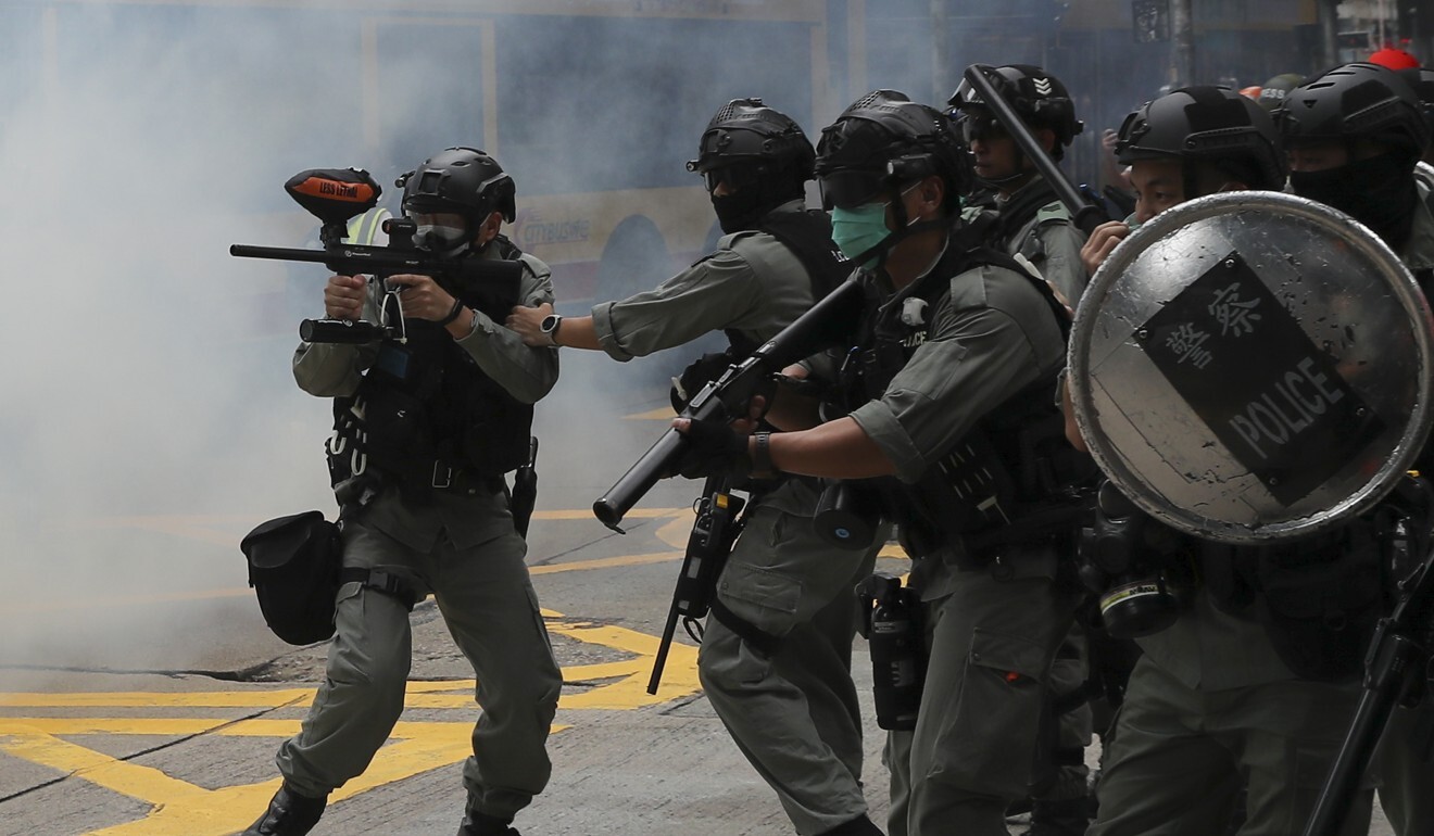 Riot police fire tear gas near the Sogo department store in Causeway Bay during a protest last May. Photo: Sam Tsang