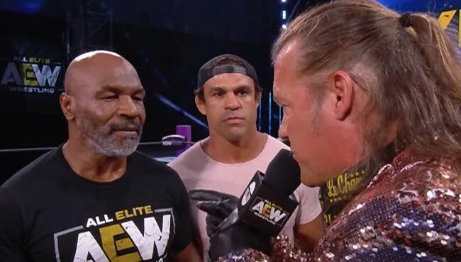 Mike Tyson, backed up by Vitor Belfort (centre), confronts Chris Jericho (right) on AEW Dynamite. Photo: AEW