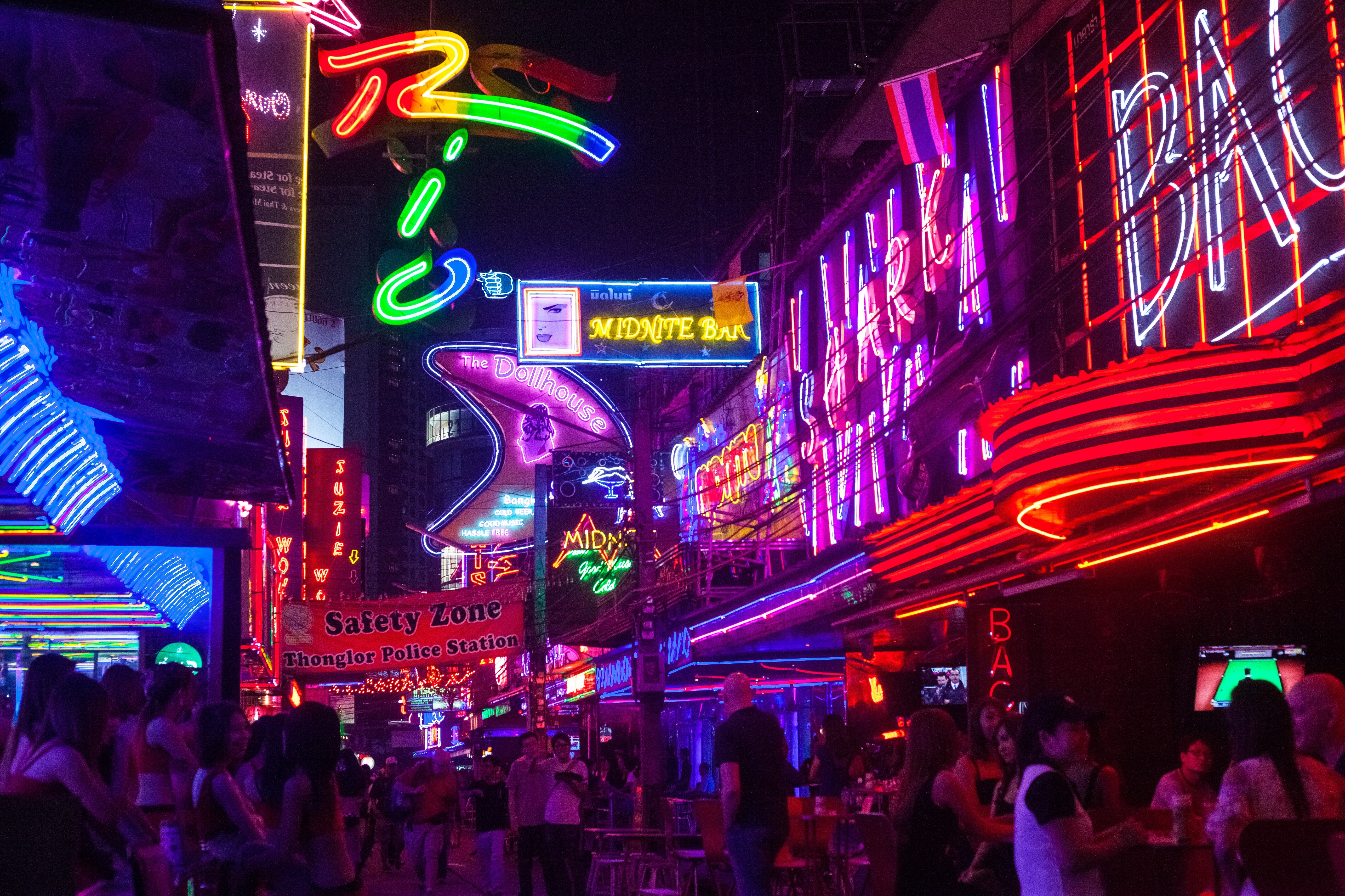 The nightlife and characters of places such as Soi Cowboy (pictured), a street in Bangkok’s red light district, has given expat crime writers inspiration for their colourful stories. Photo: Getty Images
