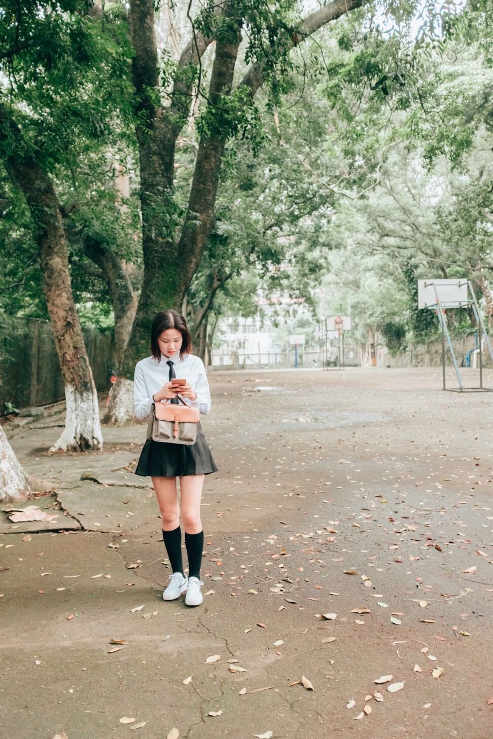 A student on her smartphone. The devices are not the primary cause of children’s poor eyesight and addiction to games, a school principal says, and schools should reduce the academic burden on students. Photo: Getty Images A student on her smartphone. The devices are not the primary cause of children’s poor eyesight and addiction to games, a school principal says, and schools should reduce the academic burden on students. Photo: Getty Images