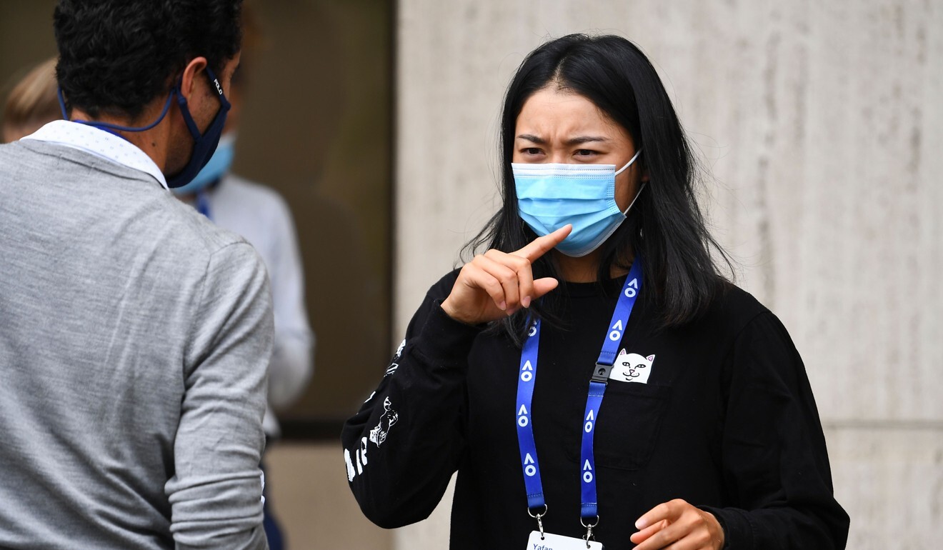 Tennis player Wang Yafan of China receives directions after a Covid-19 coronavirus test at her hotel in Melbourne. Photo: AFP