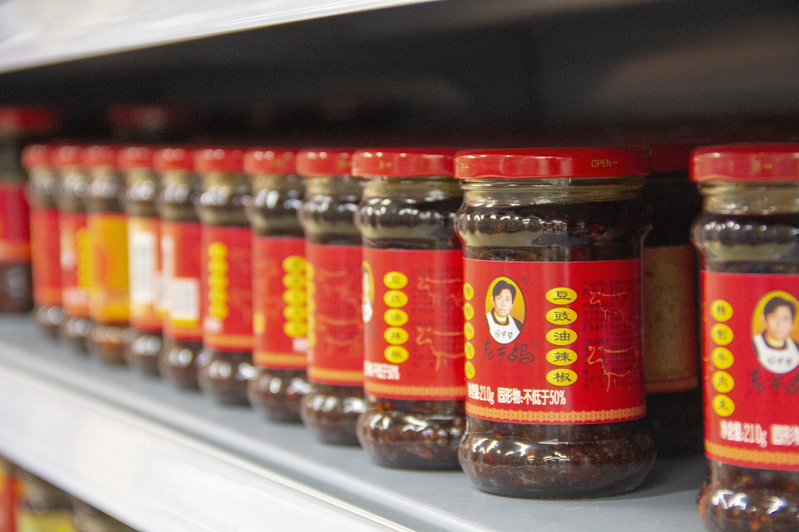 Lao Gan Ma was created by Chinese food stall owner Tao Huabi, whose stern portrait adorns every jar.