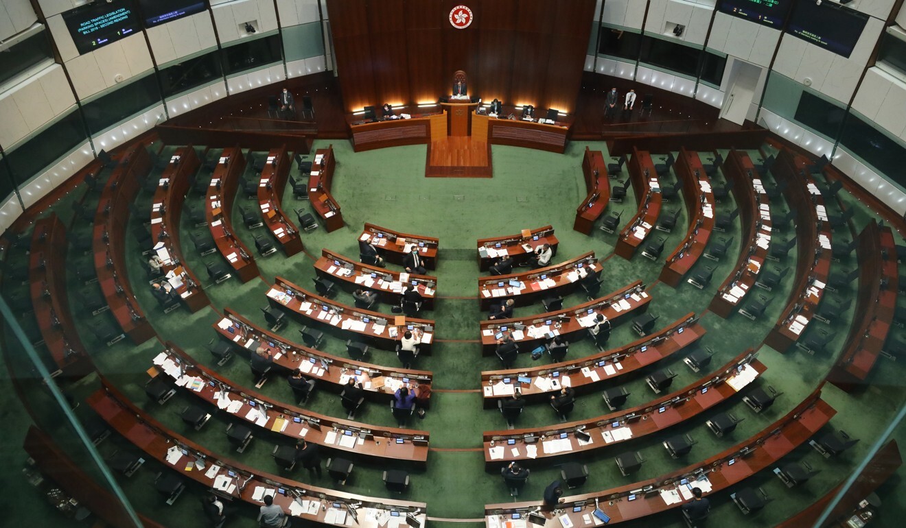 Empty seats on the opposition lawmakers’ side (right) at the Legislative Council following their resignation. Photo: Dickson Lee