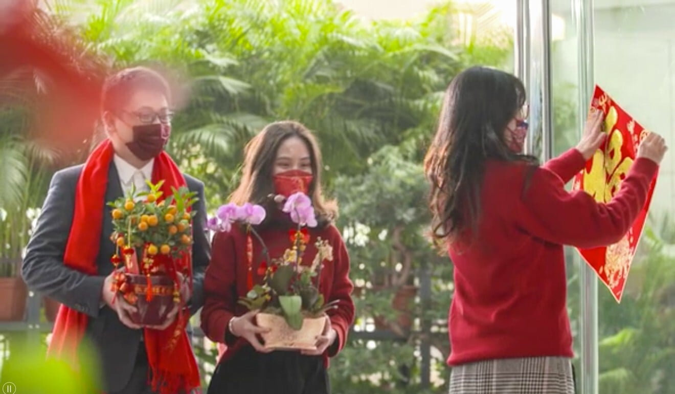 The video also shows two people bringing two small pots of auspicious plants to the liaison office compound. Photo: Handout The video also shows two people bringing two small pots of auspicious plants to the liaison office compound. Photo: Handout