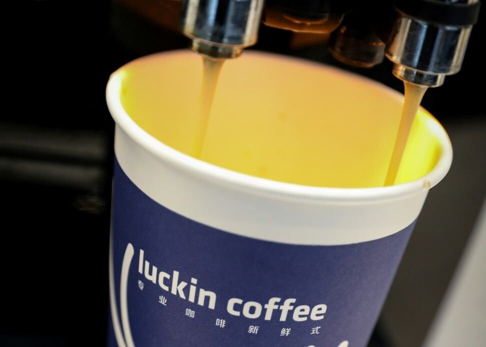 A cup of coffee is poured during Luckin Coffee's IPO at the Nasdaq Market site in New York, in May 2019. Photo: Reuters