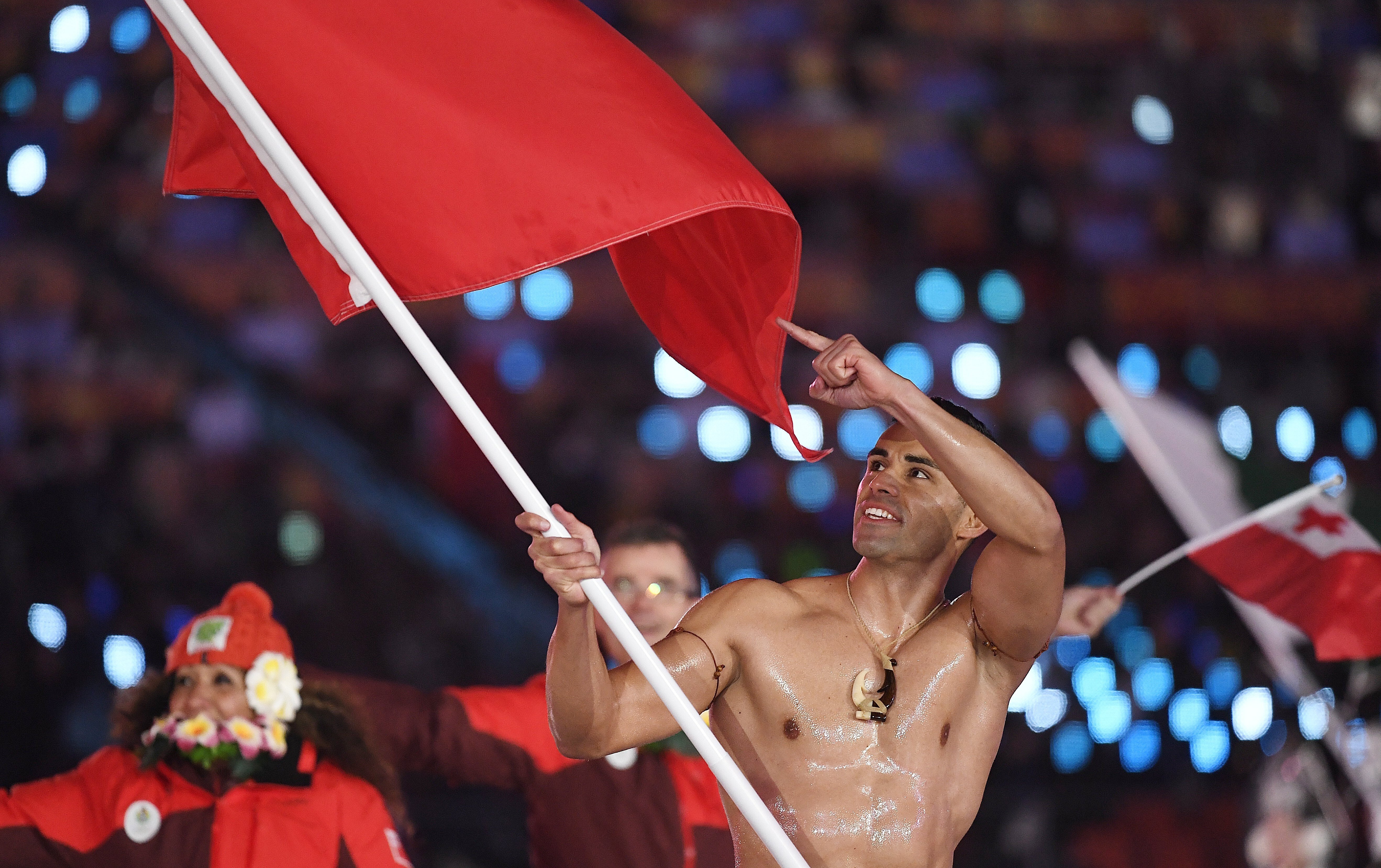 Team Tonga with flag bearer Pita Taufatofua arrive at the opening ceremony of the Pyeongchang 2018 Winter Olympic Games at the Olympic Stadium in South Korea. Photo: EPA
