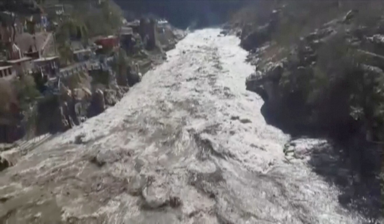 Surging floodwaters are seen in Chamoli, Uttarakhand, on Sunday in this still image obtained from a video. Photo: ANI/Reuters TV via Reuters