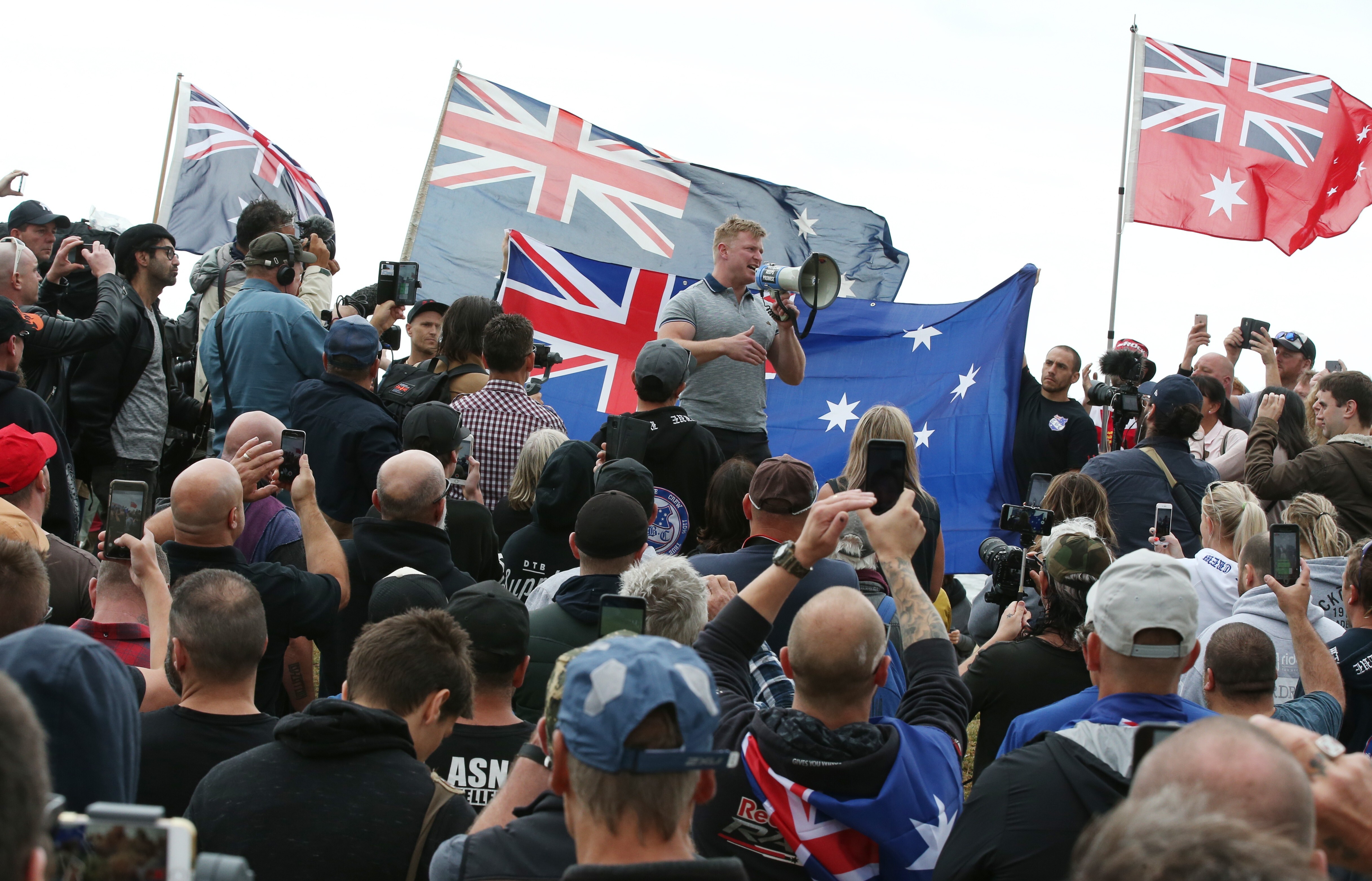 Australian far-right extremist Blair Cottrell talks to supporters at a nationalist rally in Melbourne in January 2019. Photo: EPA