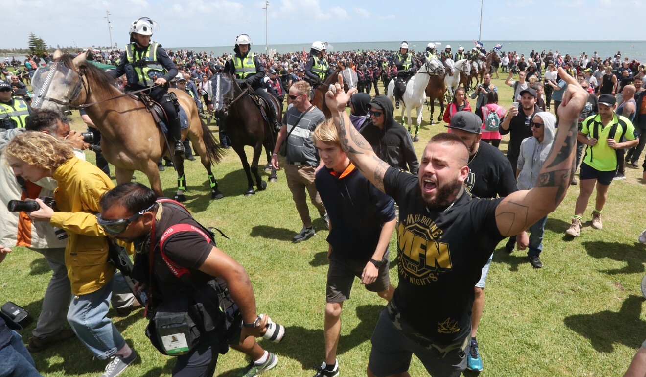 Mounted police keep nationalist protesters apart from anti-racism demonstrators in Melbourne in this 2019 file photo. Photo: EPA