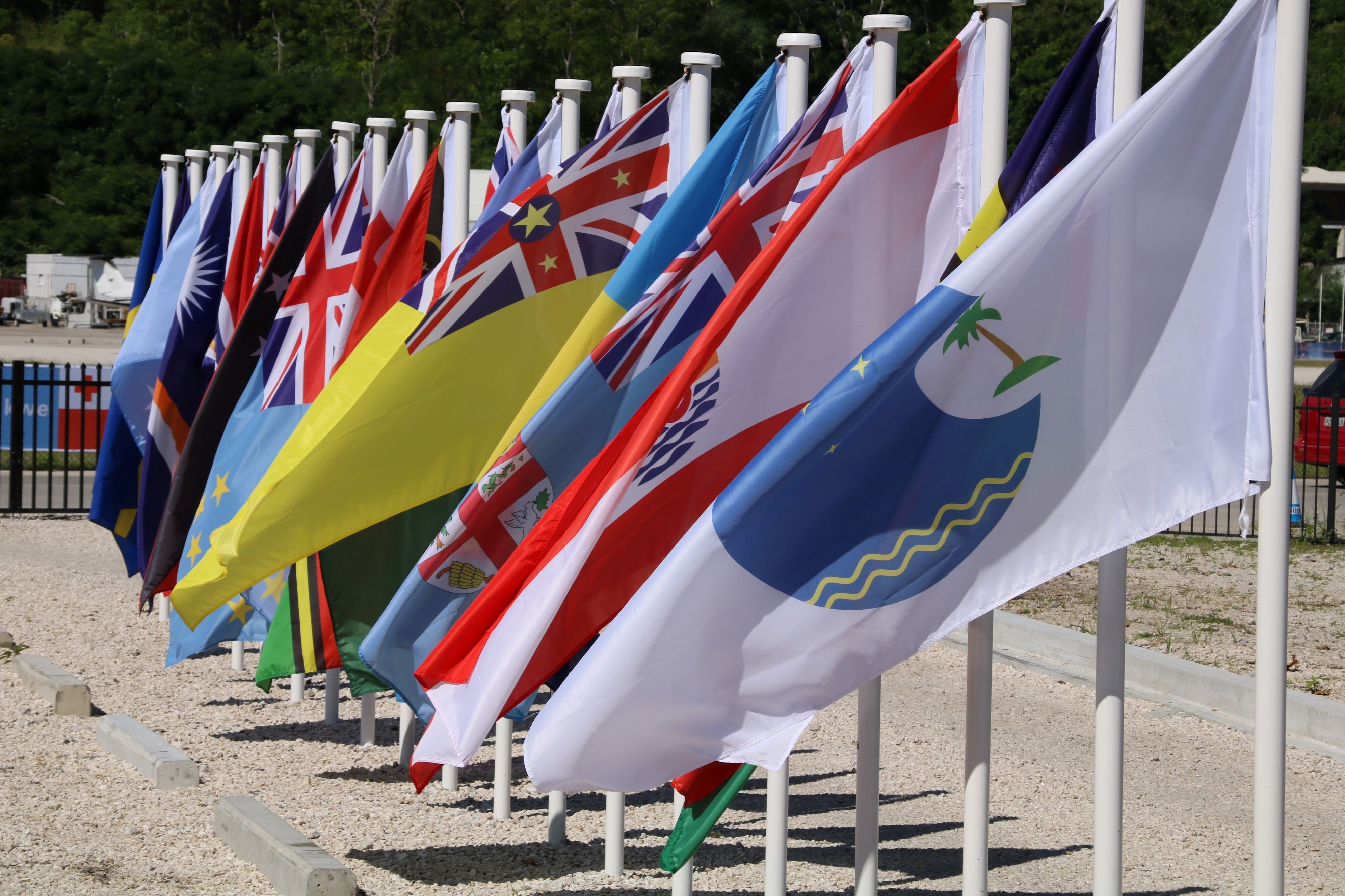 The flags representing the 18 member countries of the Pacific Islands Forum. Palau has announced it is leaving, and more nations could follow. Photo: AFP