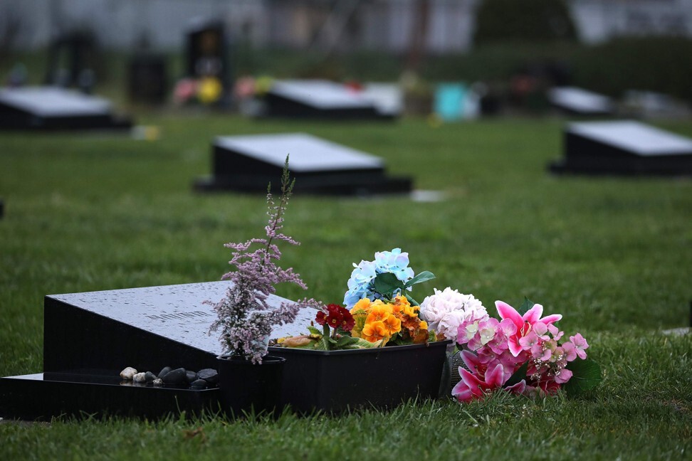 Flowers are seen on the graves of victims of the Christchurch terror attack victims at the city’s Memorial Park Cemetery last August. Photo: AFP