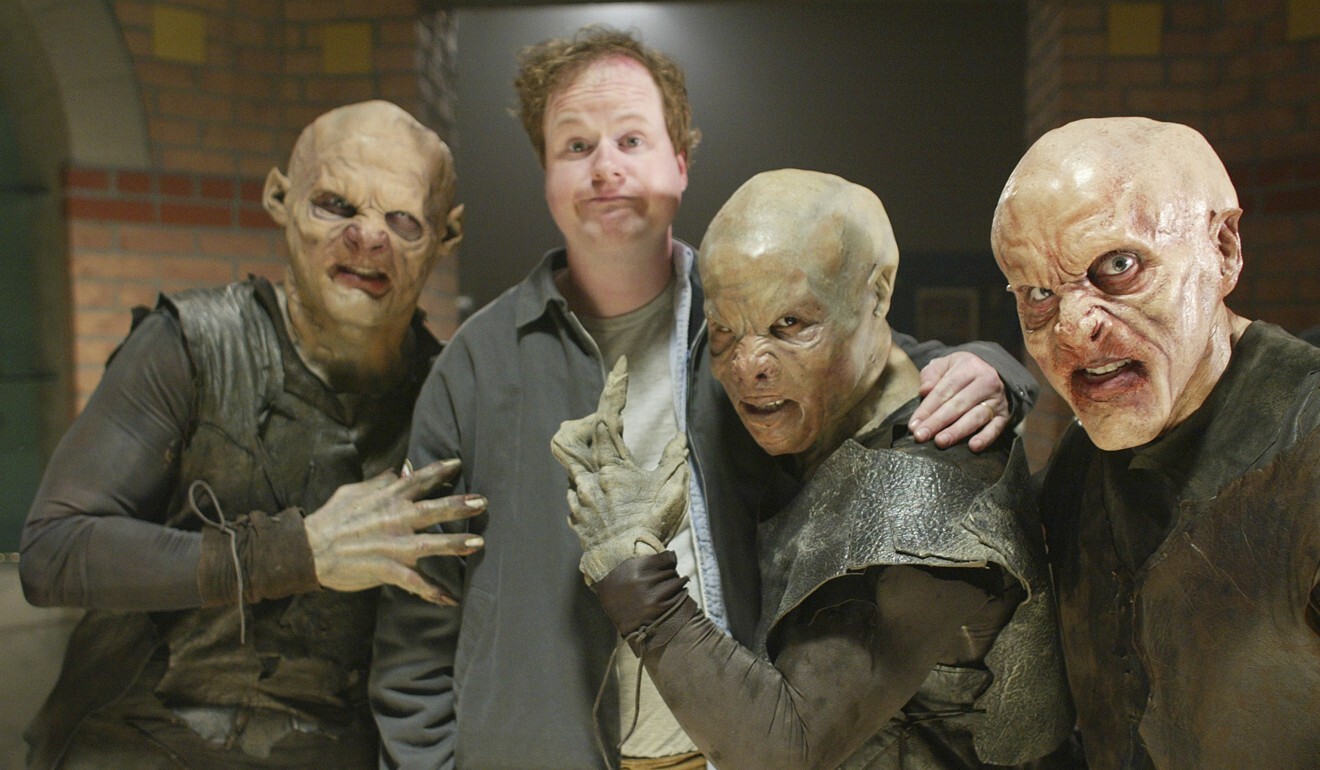 Buffy the Vampire Slayer creator Joss Whedon is surrounded by vampires during the taping of the final episode of the series in California in April 2003. Photo: AP