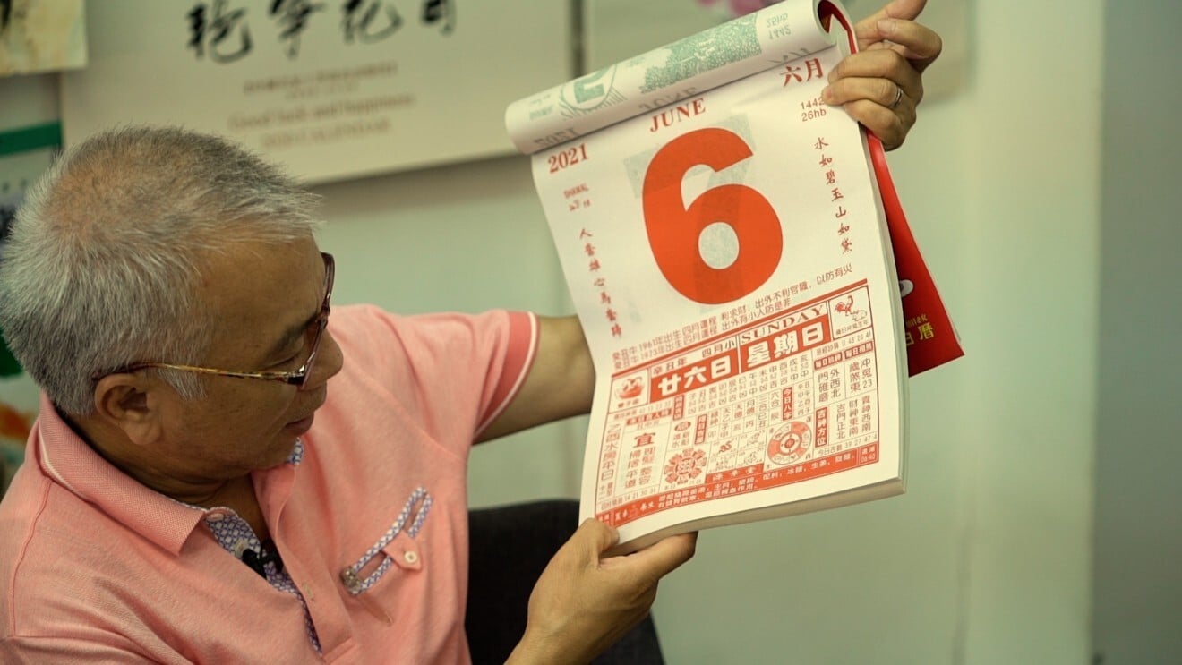 Leung Yu-time, a publisher in Hong Kong, holds up one of his company’s calendars. Photo: Goldthread