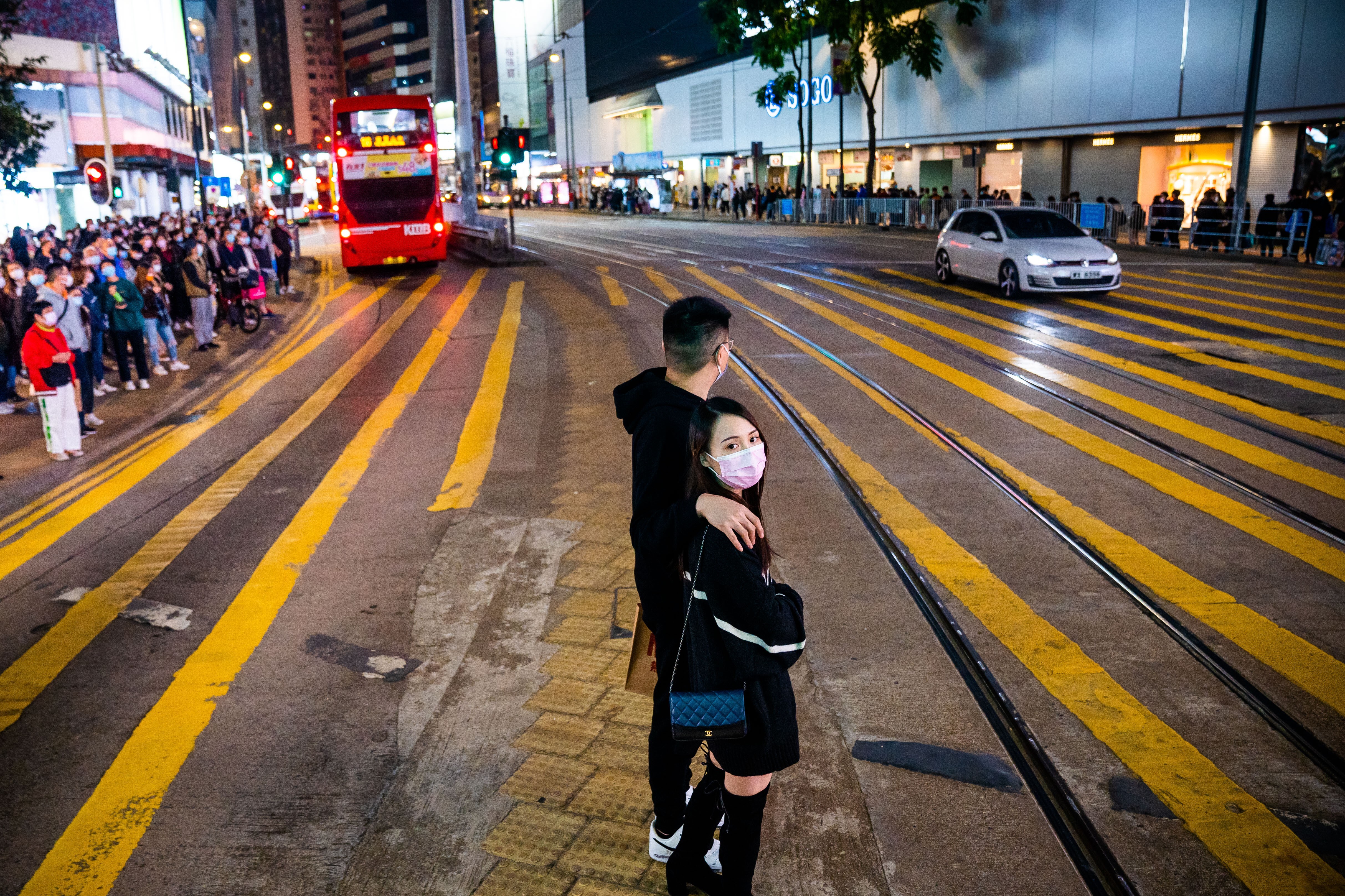 People wait to cross the road in Hong Kong on December 20. We need to redouble our efforts to create a more liveable and affordable city with a higher quality of life for all. Photo: Zuma wire/dpa