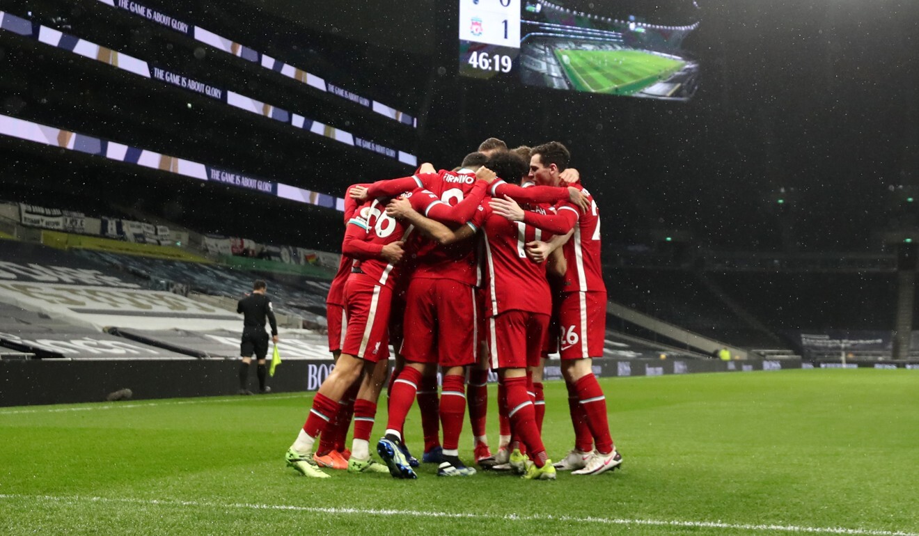 Liverpool players celebrate with Trent Alexander-Arnold after a goal against Tottenham Hotspur in the Premier League. Photo: DPA