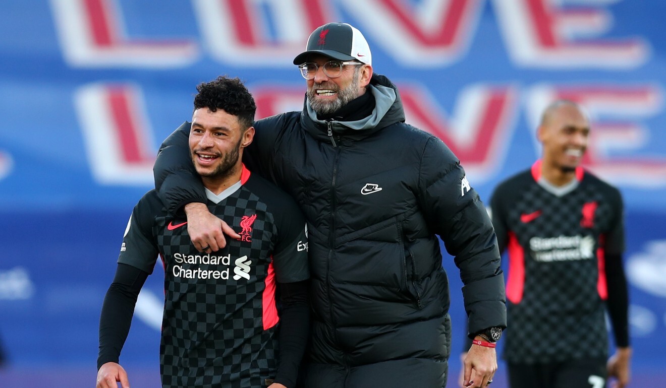 Liverpool manager Jurgen Klopp and Alex Oxlade-Chamberlain celebrate after winning against Crystal Palace last December. Photo: Reuters