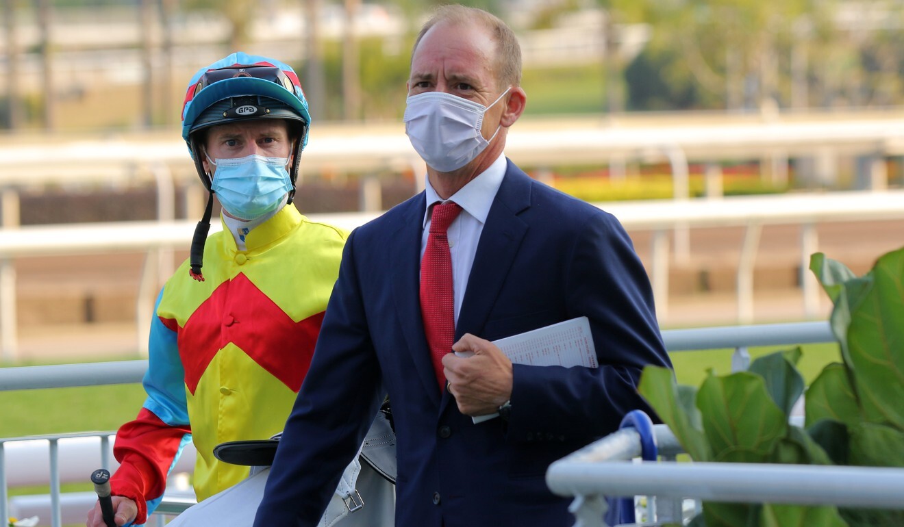 Jockey Zac Purton and trainer Richard Gibson after Wellington’s win.