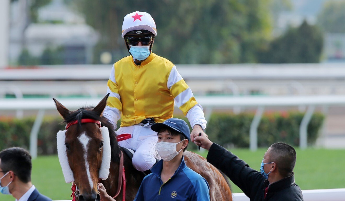 Christophe Soumillon celebrates his win aboard Decisive Action with trainer Danny Shum. Photo: Kenneth Chan