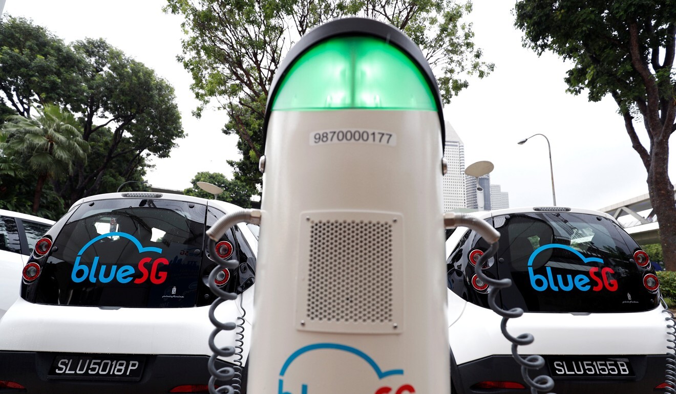 BlueSG electric car-sharing vehicles are parked at a charging station in Singapore. Photo: Reuters