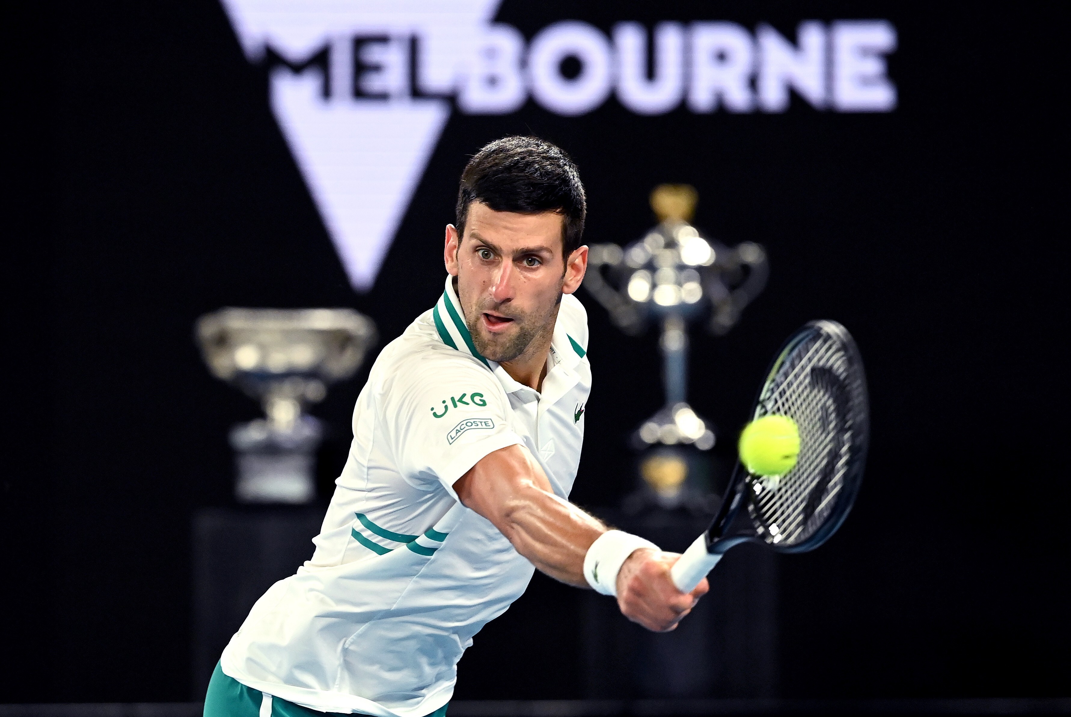 Novak Djokovic reaches to hit a return against Aslan Karatsev in their Australian Open semi-final on Thursday. Photo: Photo: EPA