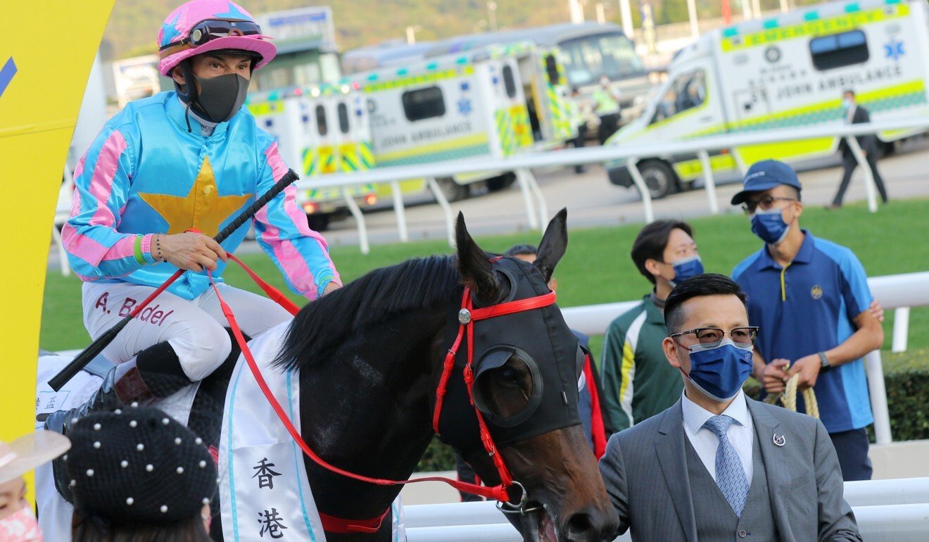 Jockey Alexis Badel and trainer Frankie Lor after Healthy Happy’s victory.