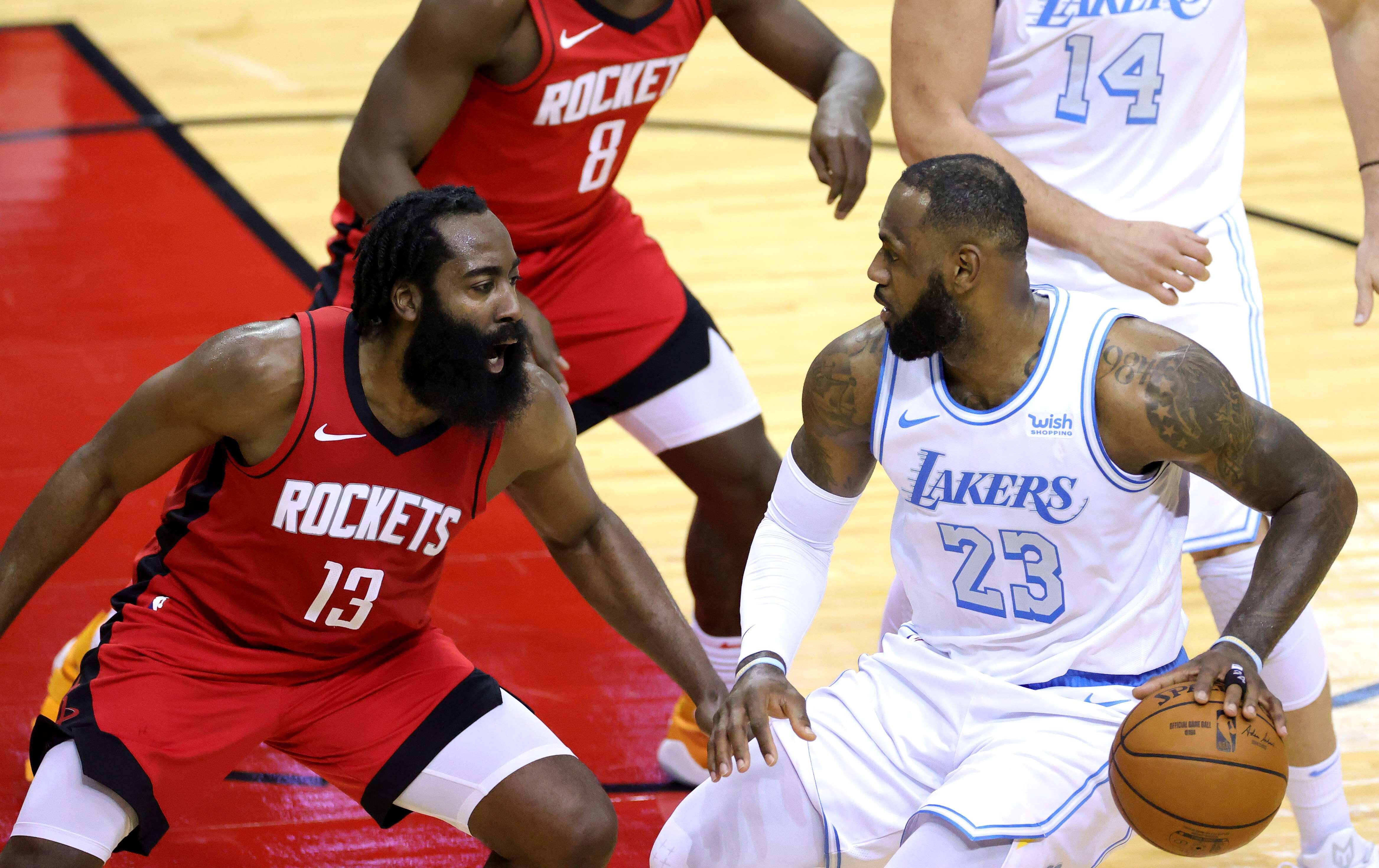 LeBron James of the Los Angeles Lakers takes on James Harden of the Houston Rockets in the NBA in January. Photo: AFP