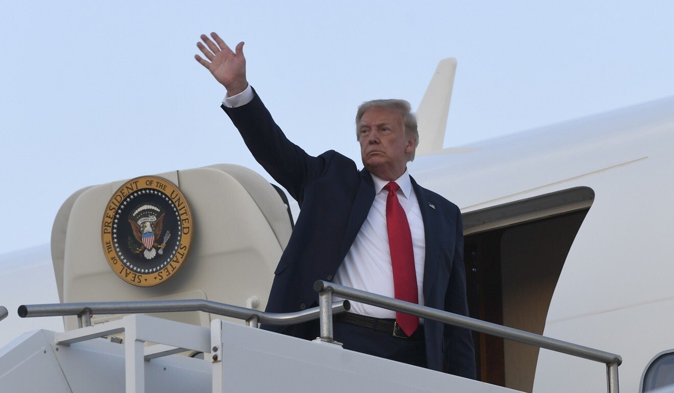 Donald Trump waves from the top of the steps of Air Force One in August last year. Photo: AP