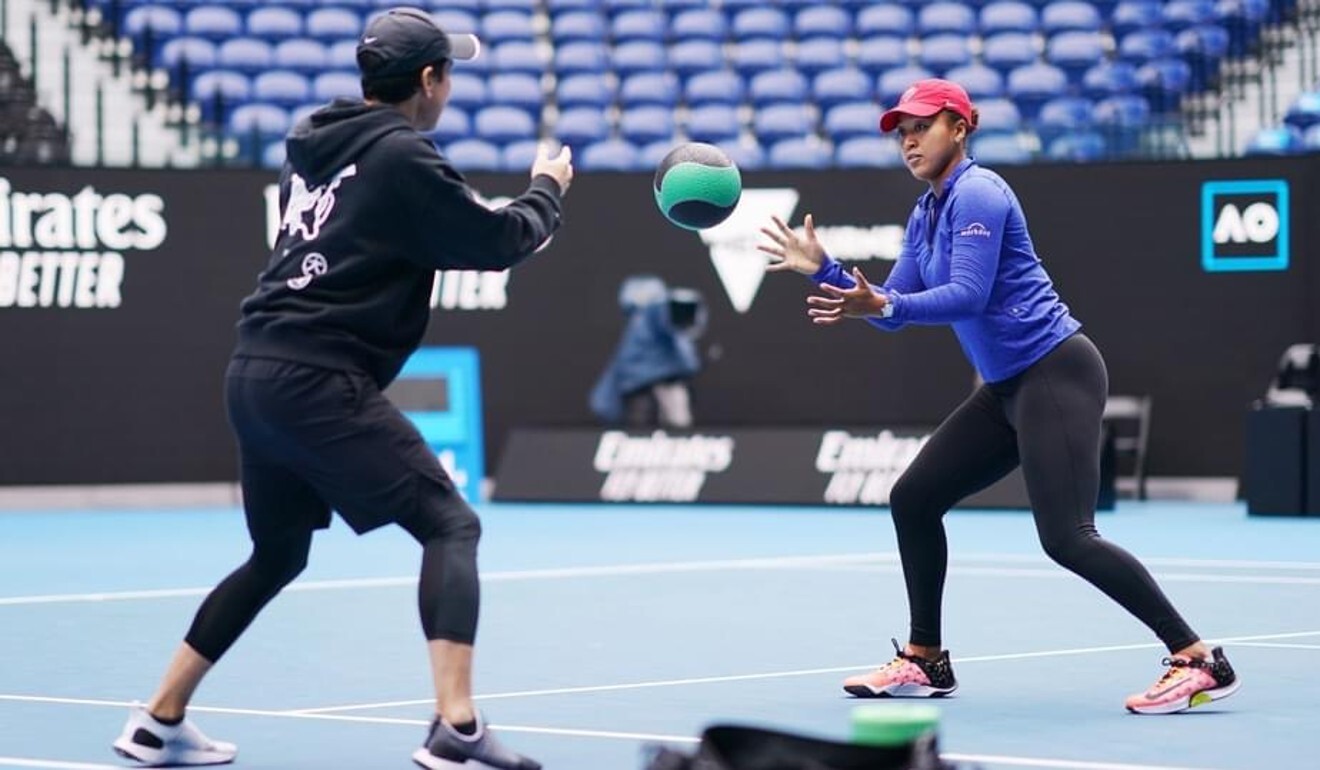 Yutaka Nakamura trains with Naomi Osaka during the Australian Open in Melbourne. Photo: Australian Open