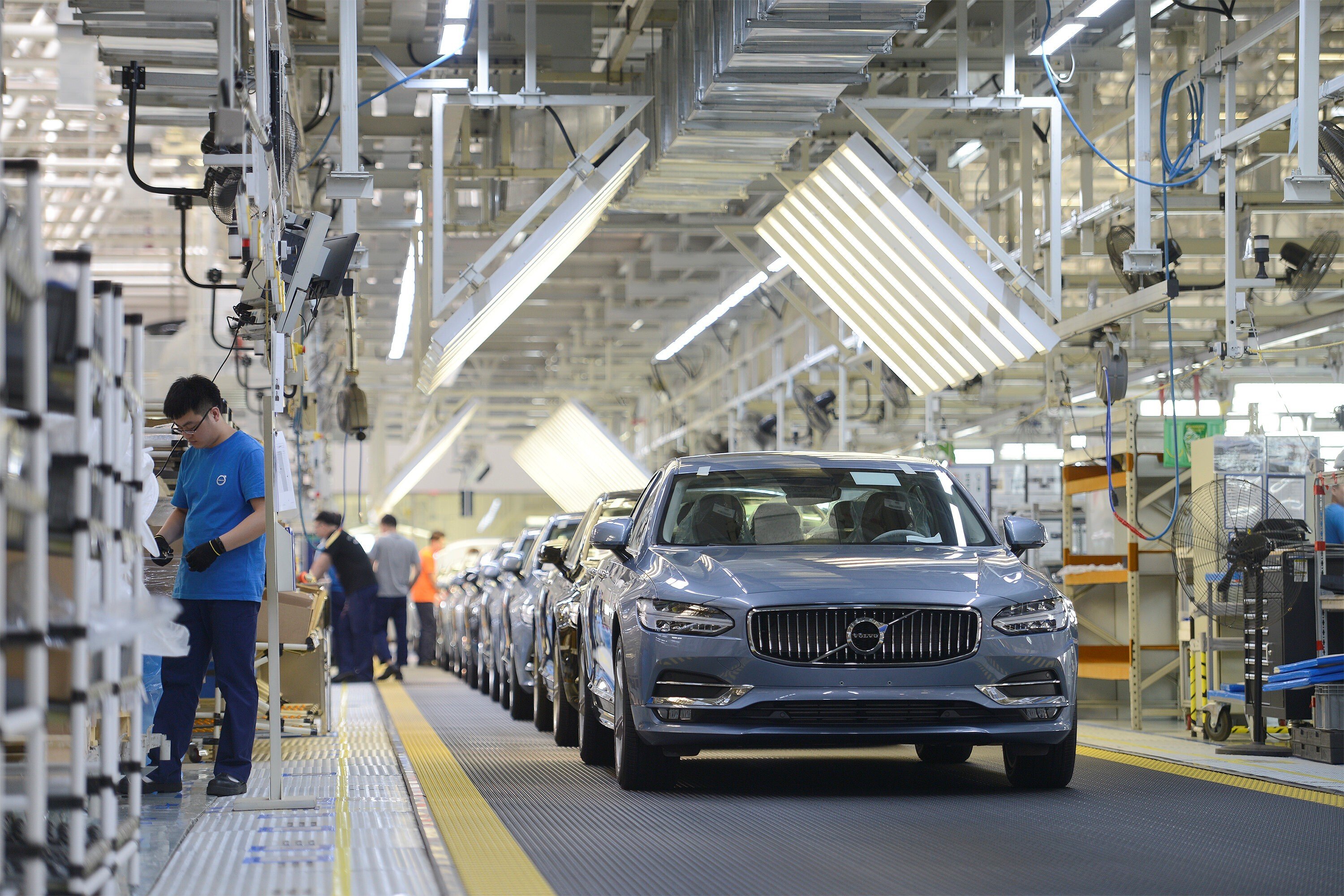 Workers are seen on the side of an assembly line at the Volvo Cars manufacturing plant in Daqing, Heilongjiang province in June 2018. Photo: Reuters